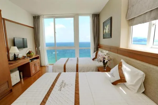 Bed in Dendro beachfront Hotel