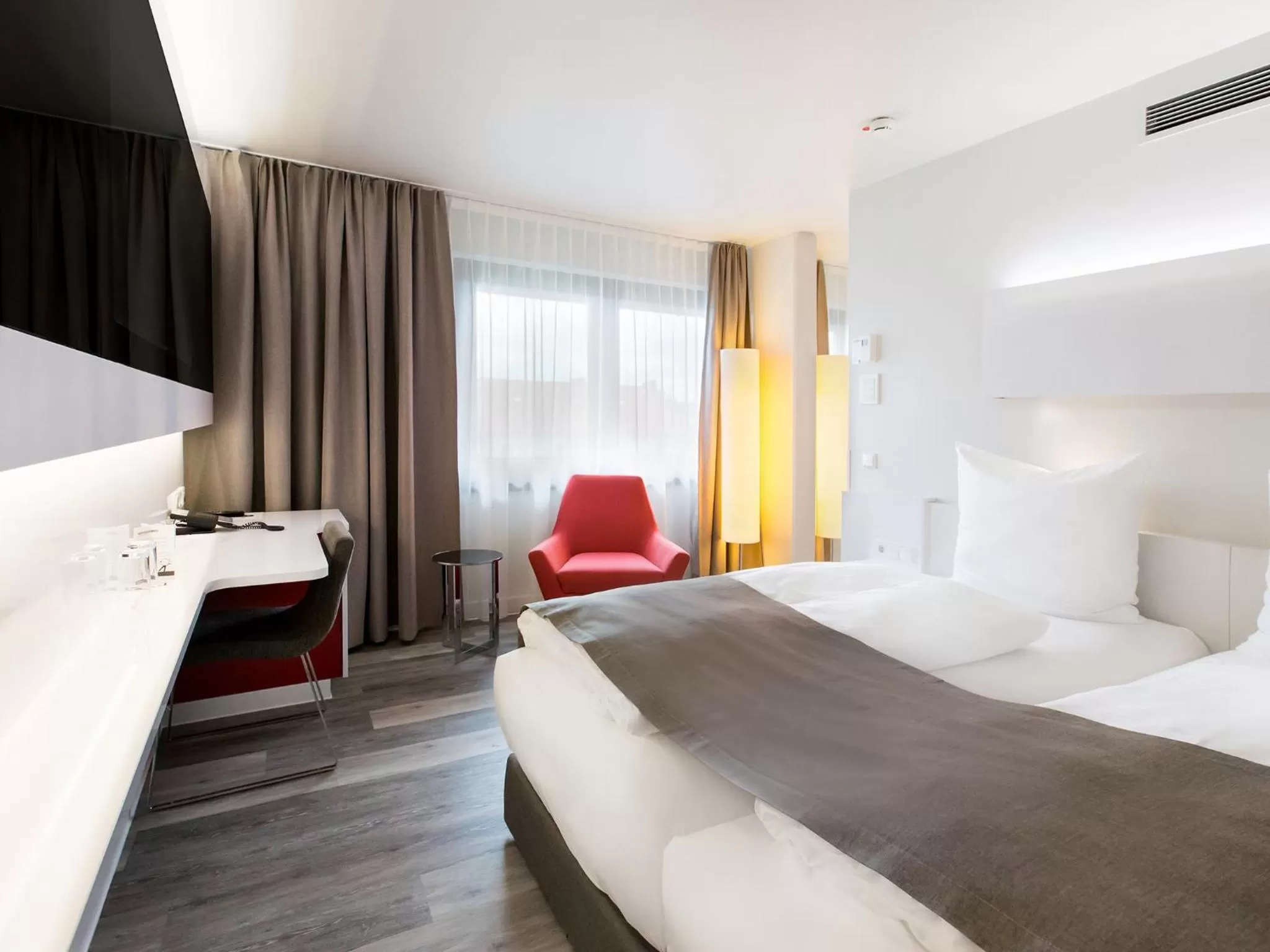 Photo of the whole room, Bed in DORMERO Hotel Hannover