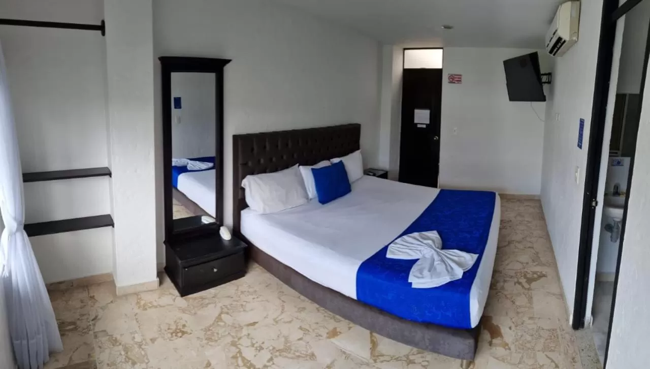 Bed in Blue Star Hotel