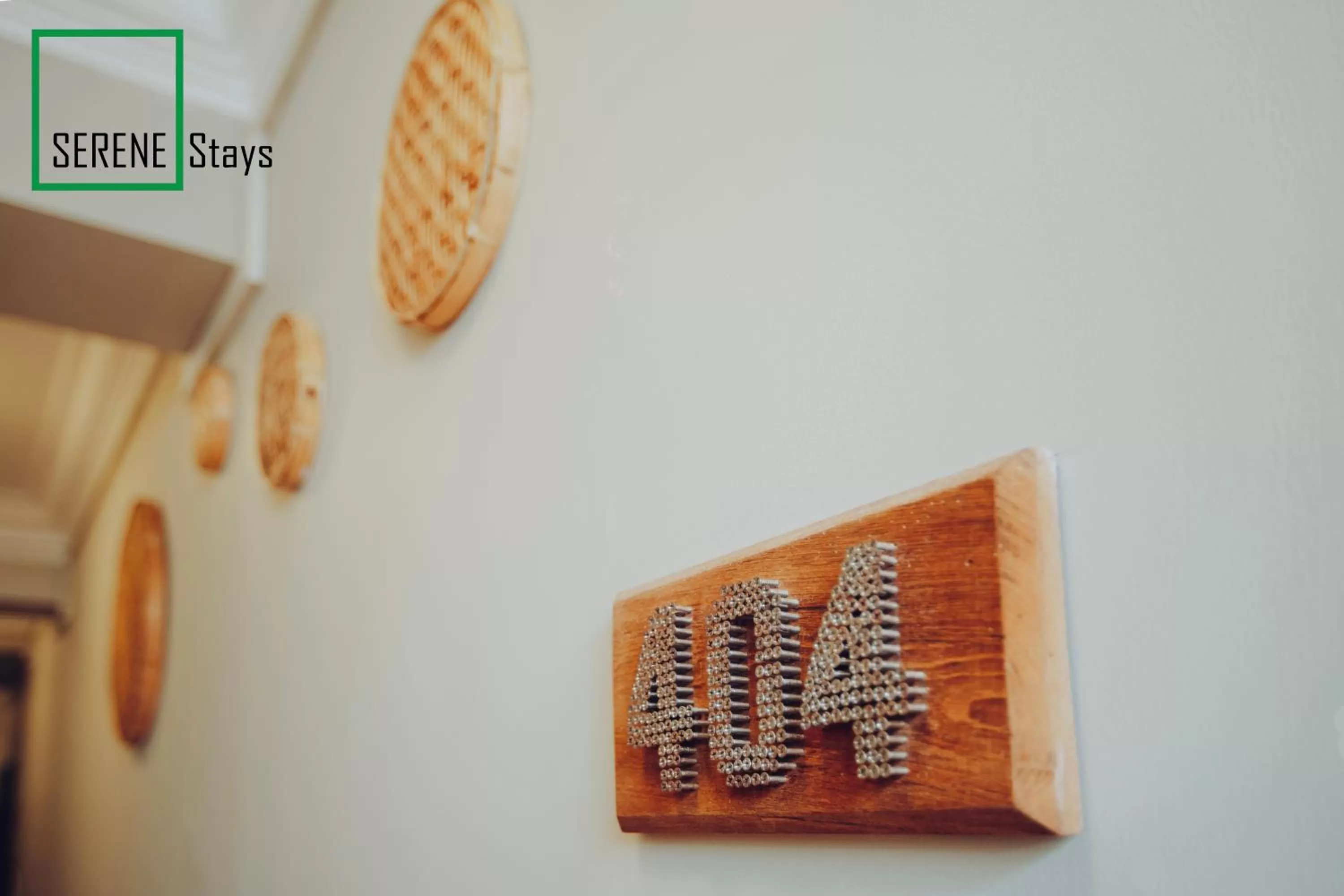 Logo/Certificate/Sign in SERENE Stays Hotel