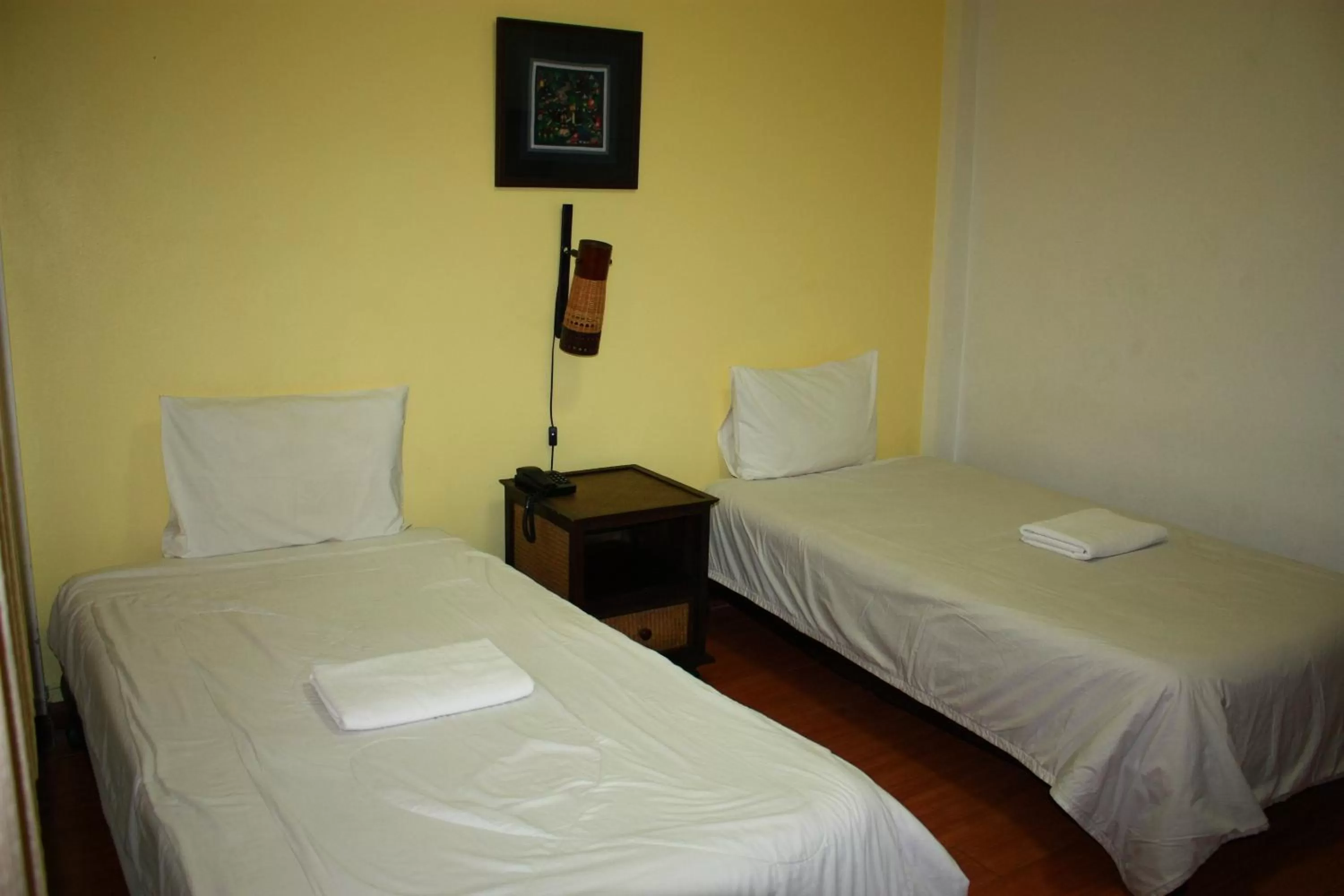 Bed in โรงแรมตีฆ้อง - Tri Gong Hotel