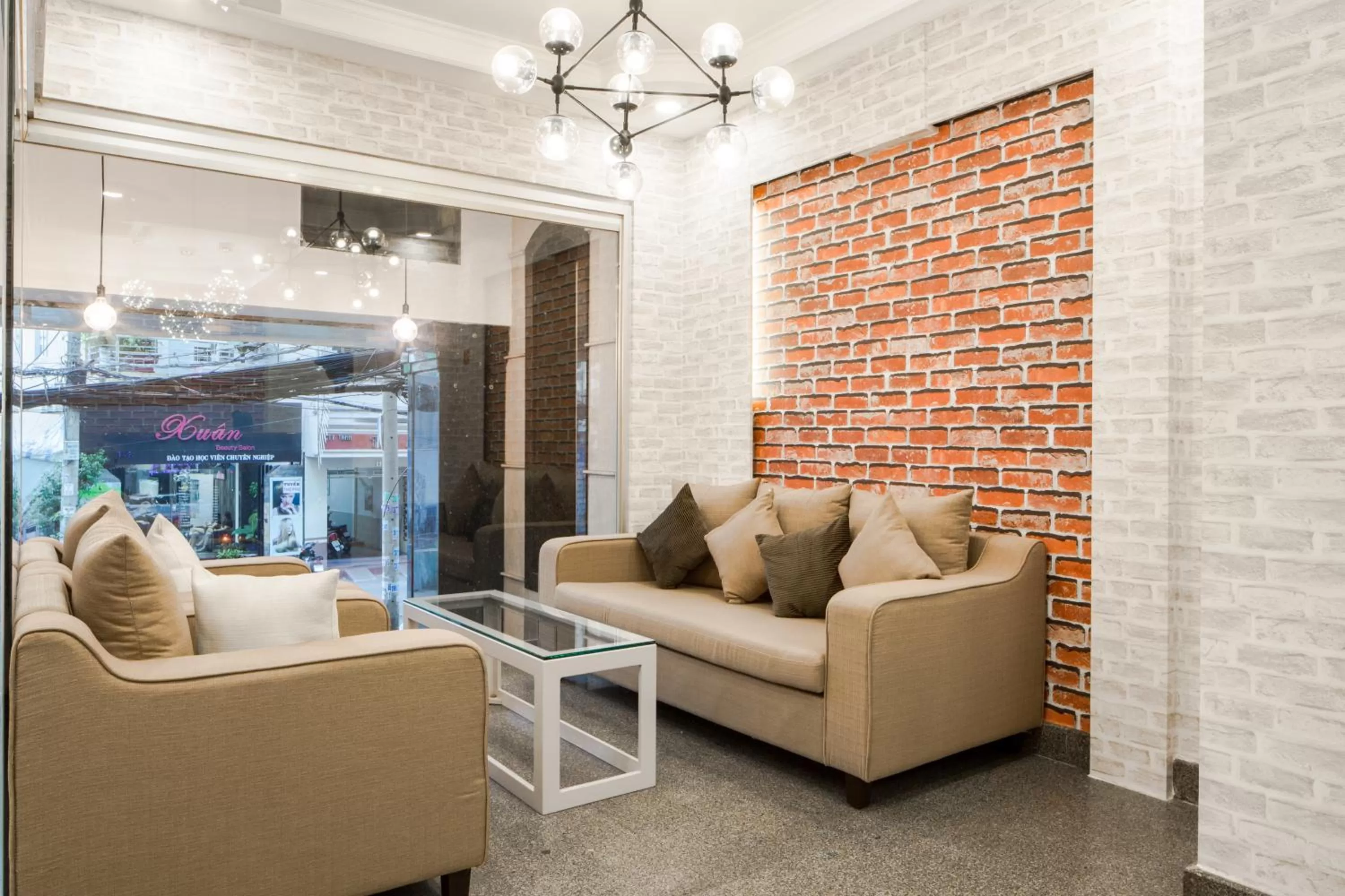 Communal lounge/ TV room in Little Brick Saigon Hotel