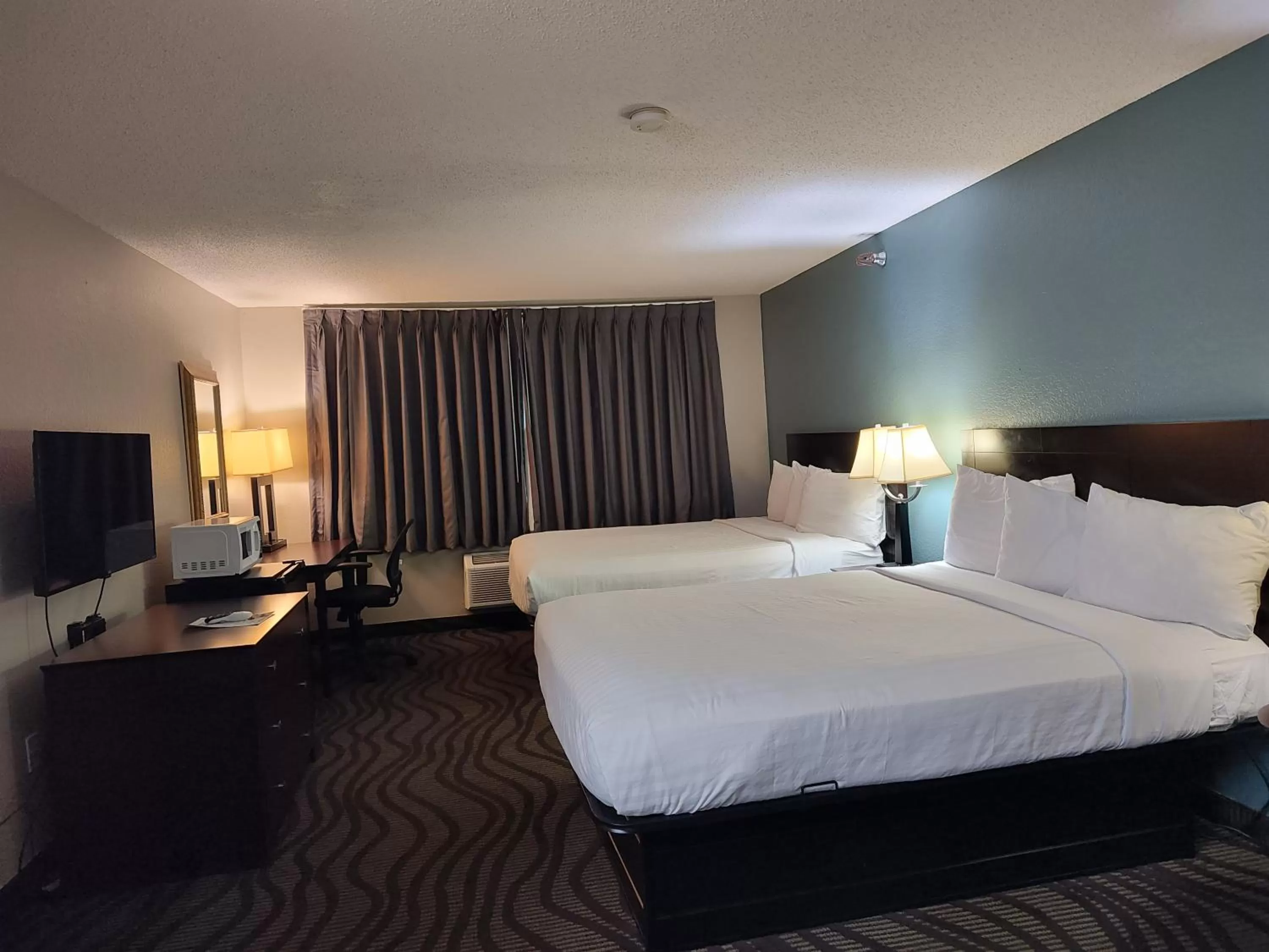 Bed in Baymont Inn & Suites by Wyndham Lincoln NE