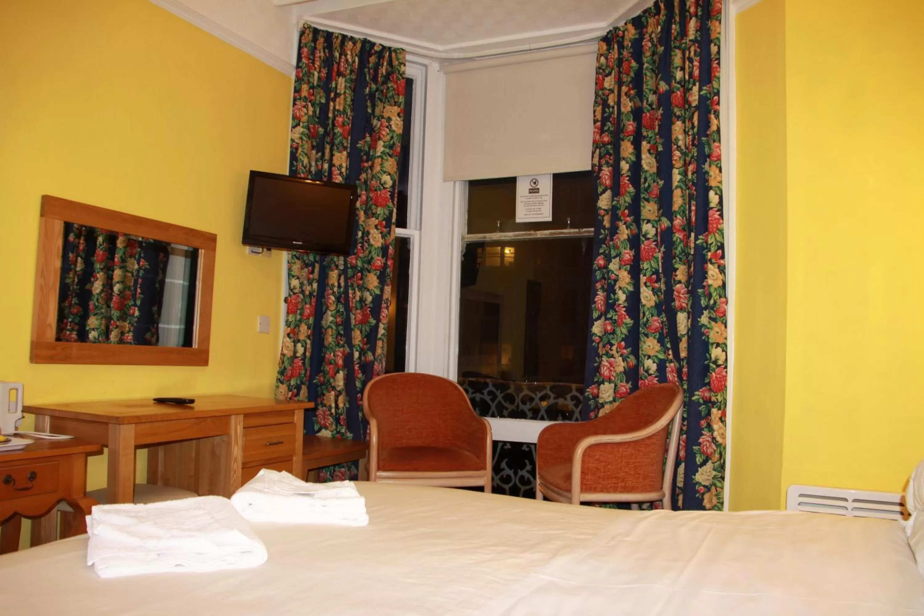 Bed in Ambassador Hotel