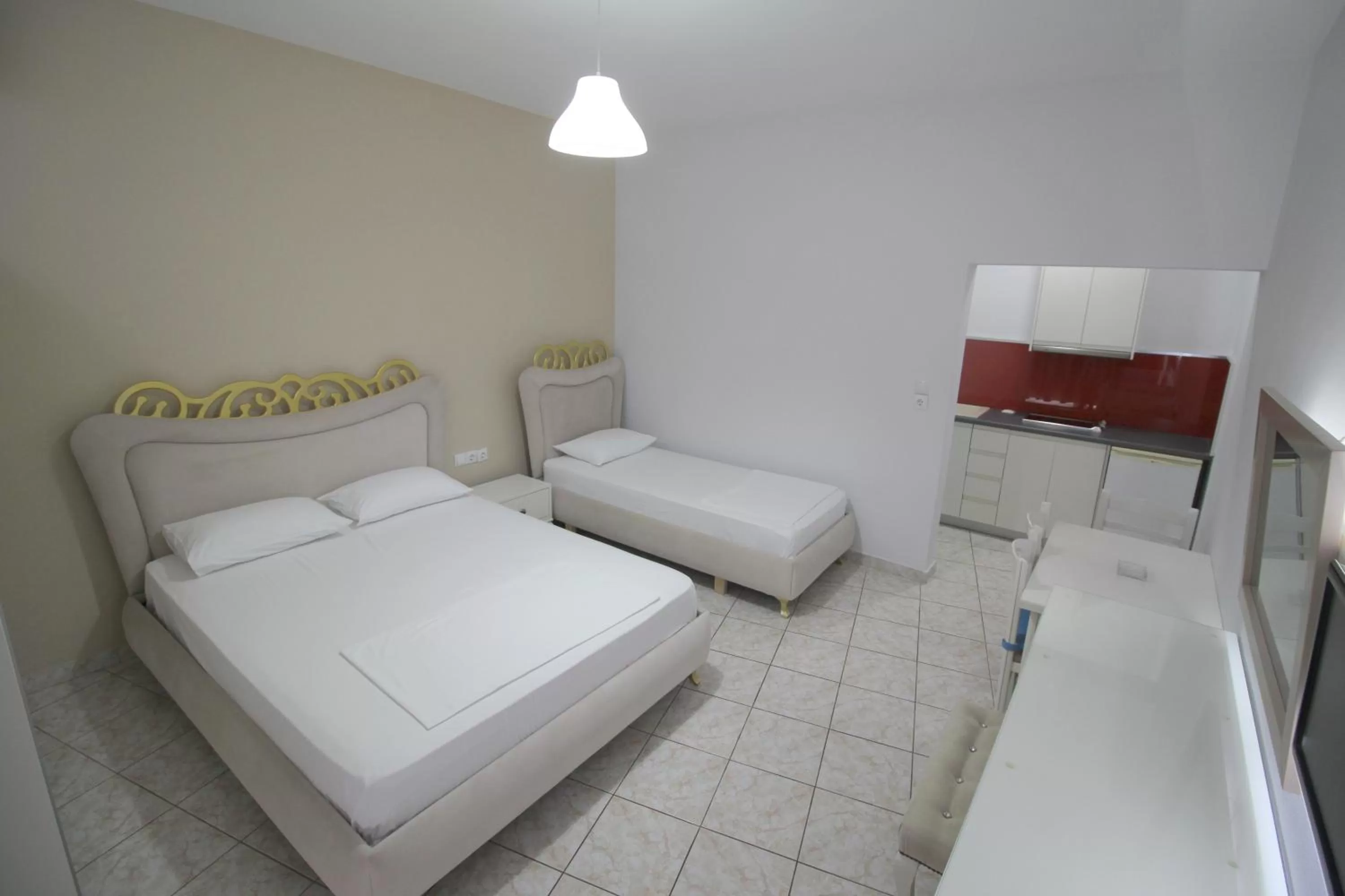 Bed in Murati Suites Sarandë