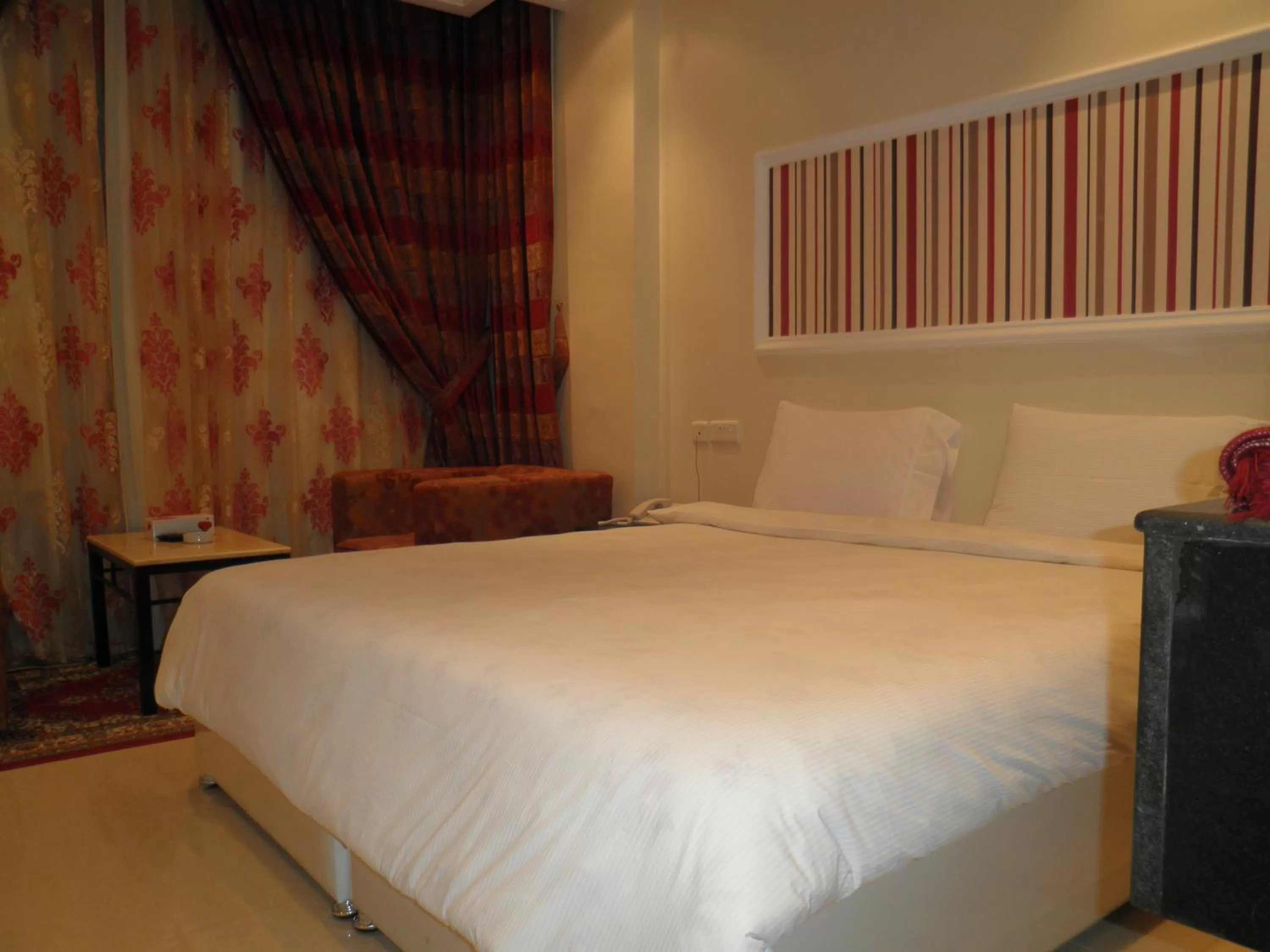 Bed in Marina Royal Hotel Suites