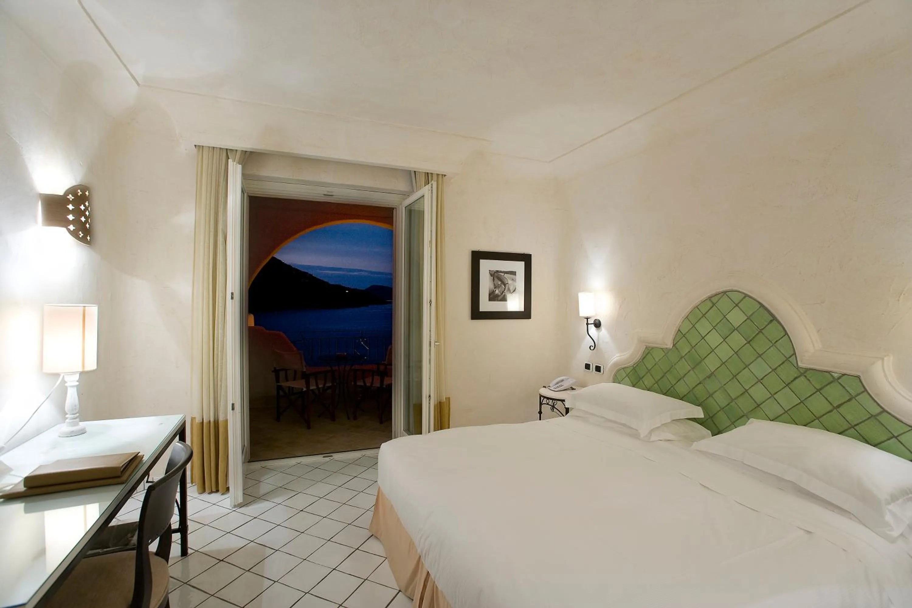 Photo of the whole room, Bed in Therasia Resort Sea and SPA - The Leading Hotels of the World