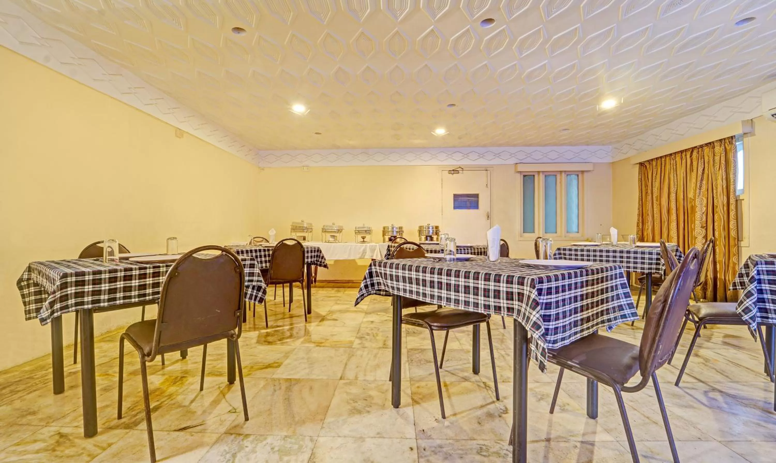 Dining area in Treebo Vinayak Inn, 600 Mts From Coimbatore Railway Station