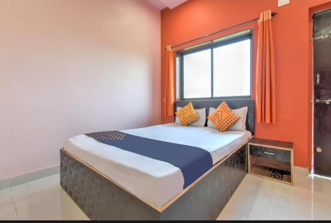 Bed in Hotel Nisarg Lodging And Restaurant