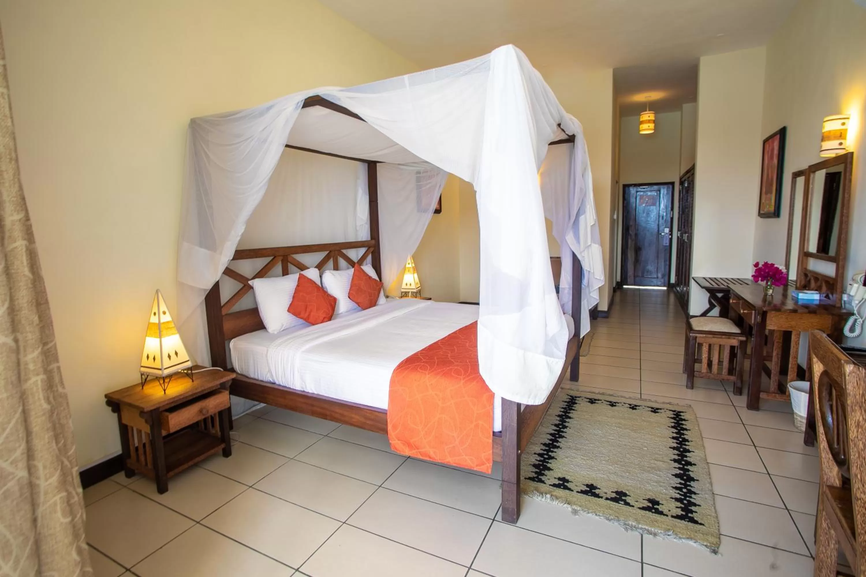 Bed in CityBlue Creekside Hotel & Suites