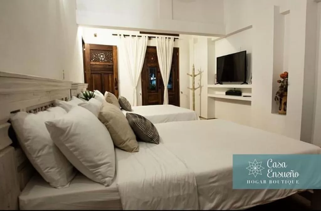 Communal lounge/ TV room, Bed in Casa Ensueño Hogar Boutique
