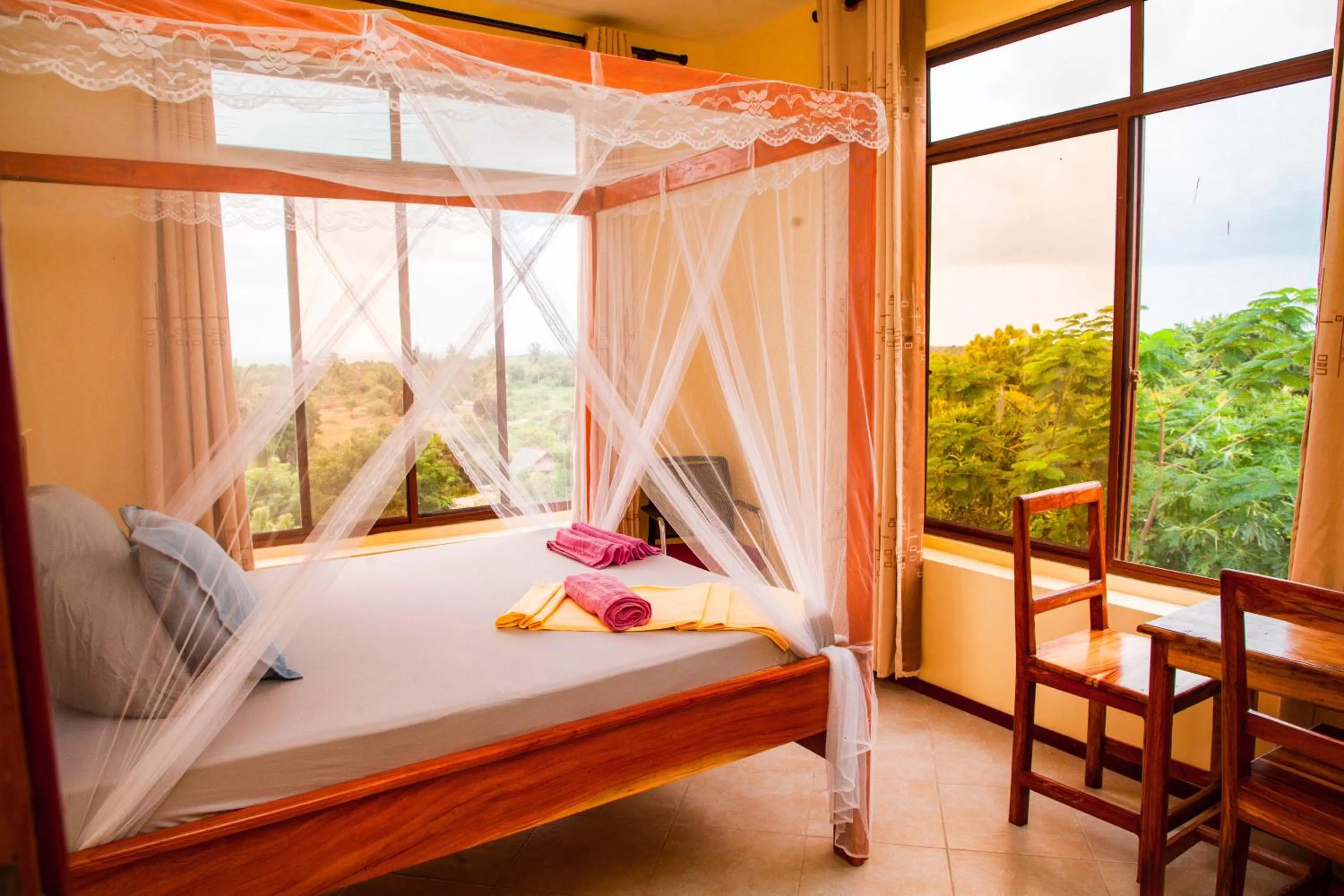 Bed in Mikoko Beach & Cottages
