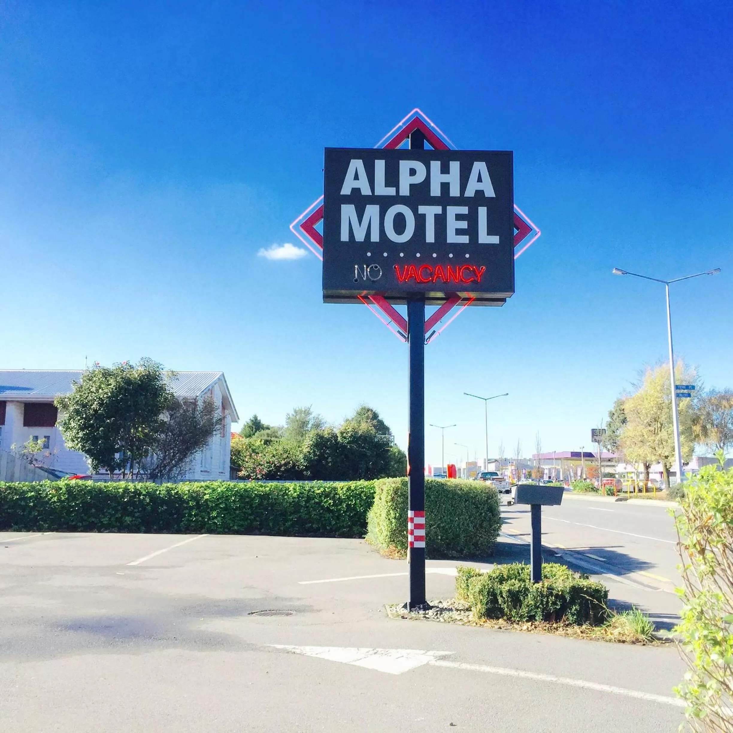 Property logo or sign in Alpha Motel with Spa-Bath