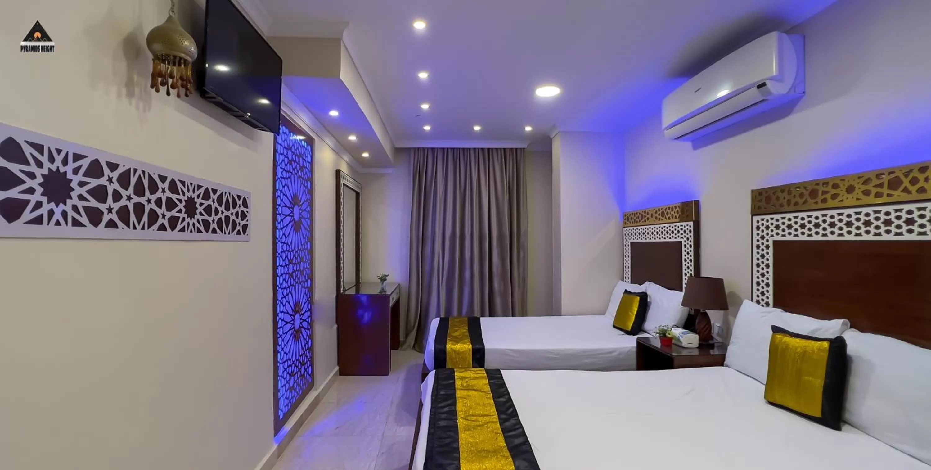 Bed in Pyramids Height Hotel & Pyramids Master Scene Rooftop