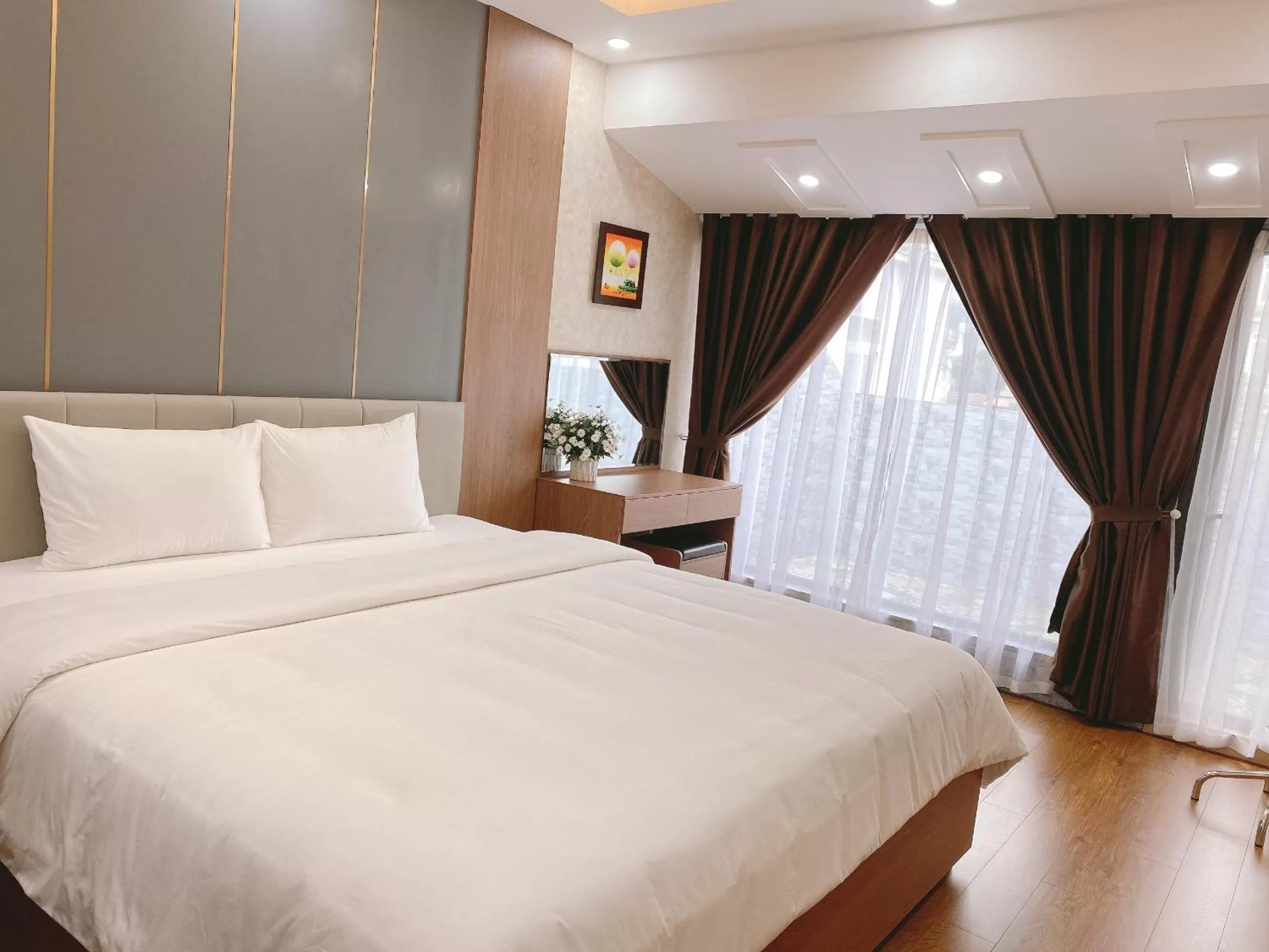 Bed in Galaxy Grand Hotel