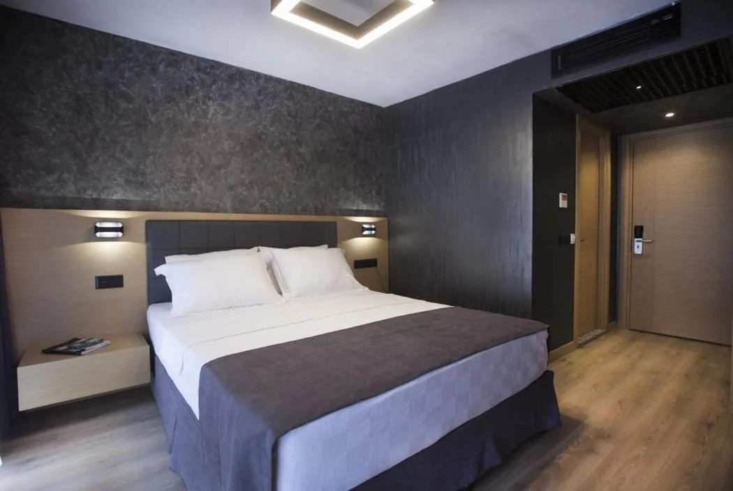 Bed in Red Stone Hotel