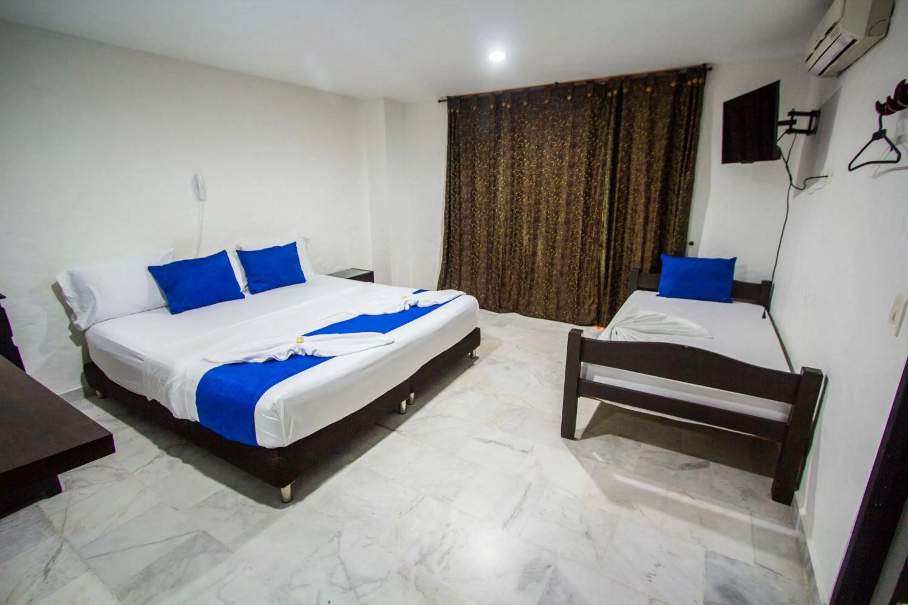 Bed in Blue Star Hotel