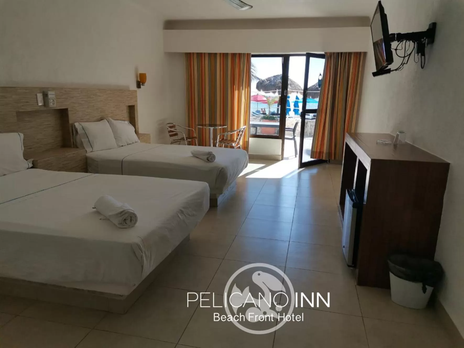 Photo of the whole room, Bed in Pelicano Inn Playa del Carmen - Beachfront Hotel