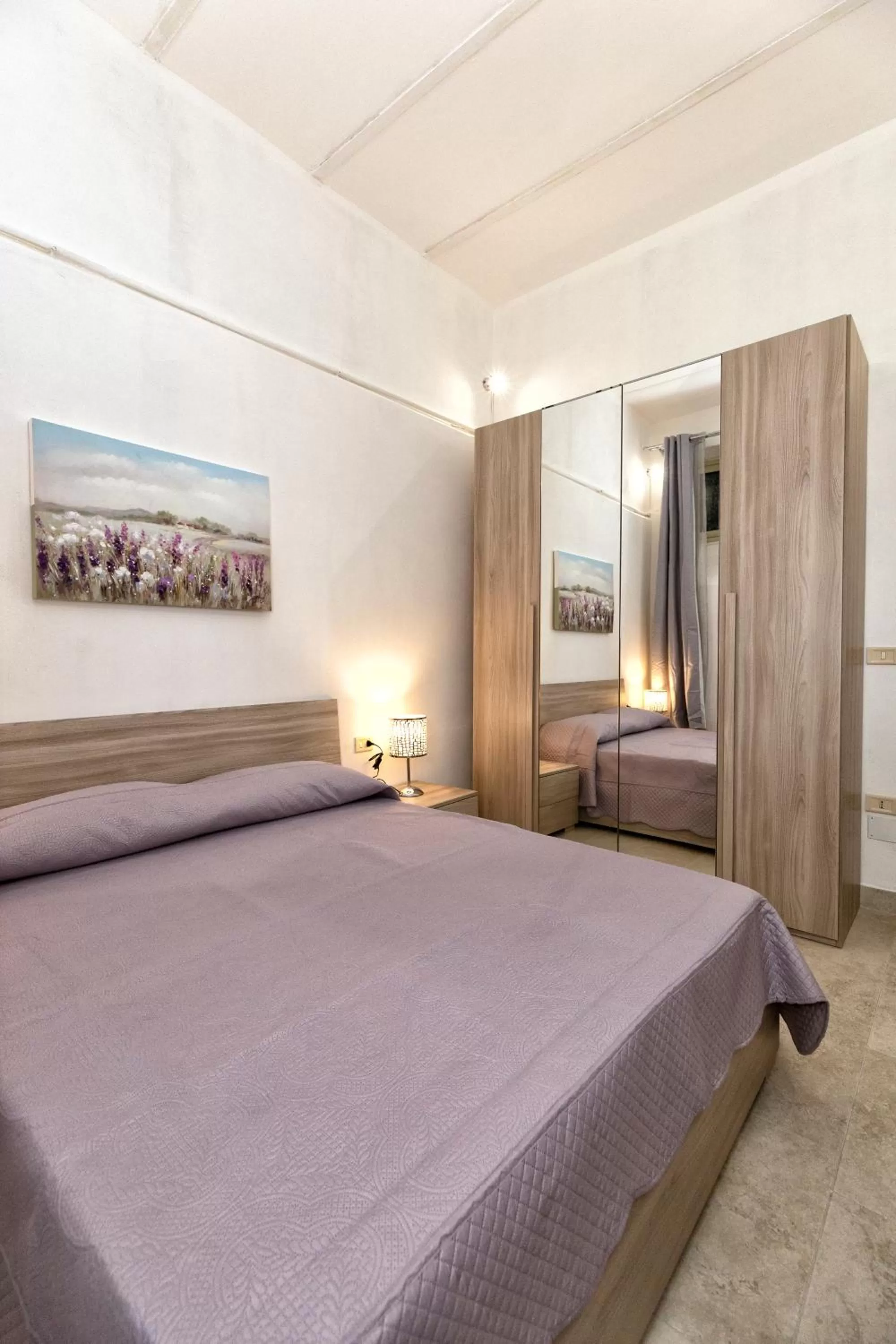 Bed in GARDEN HOUSE: APARTMENTS AND ROOMS FOR HOLIDAYS