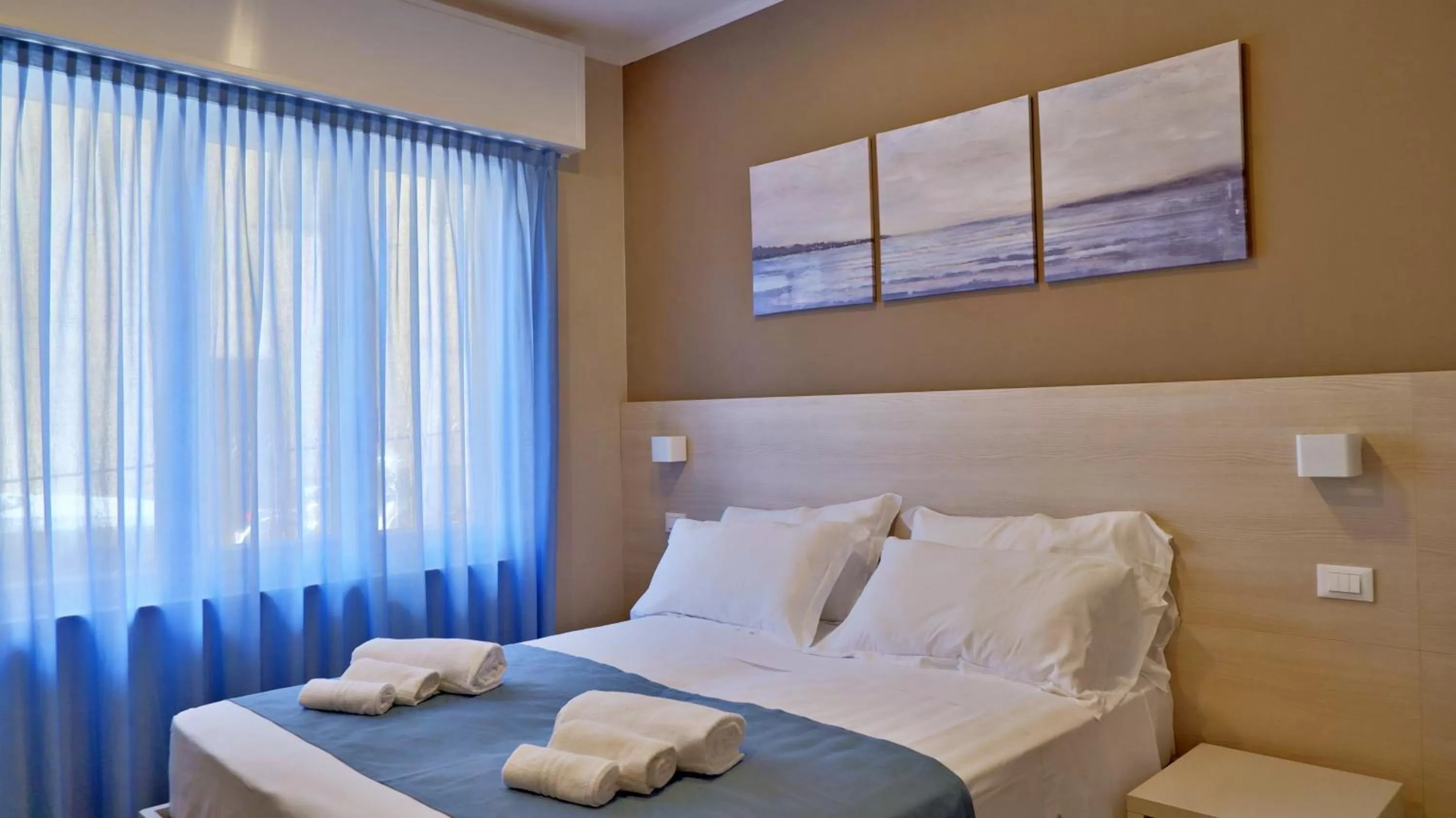 Bed in Pianomare Riviera Apartments and Rooms