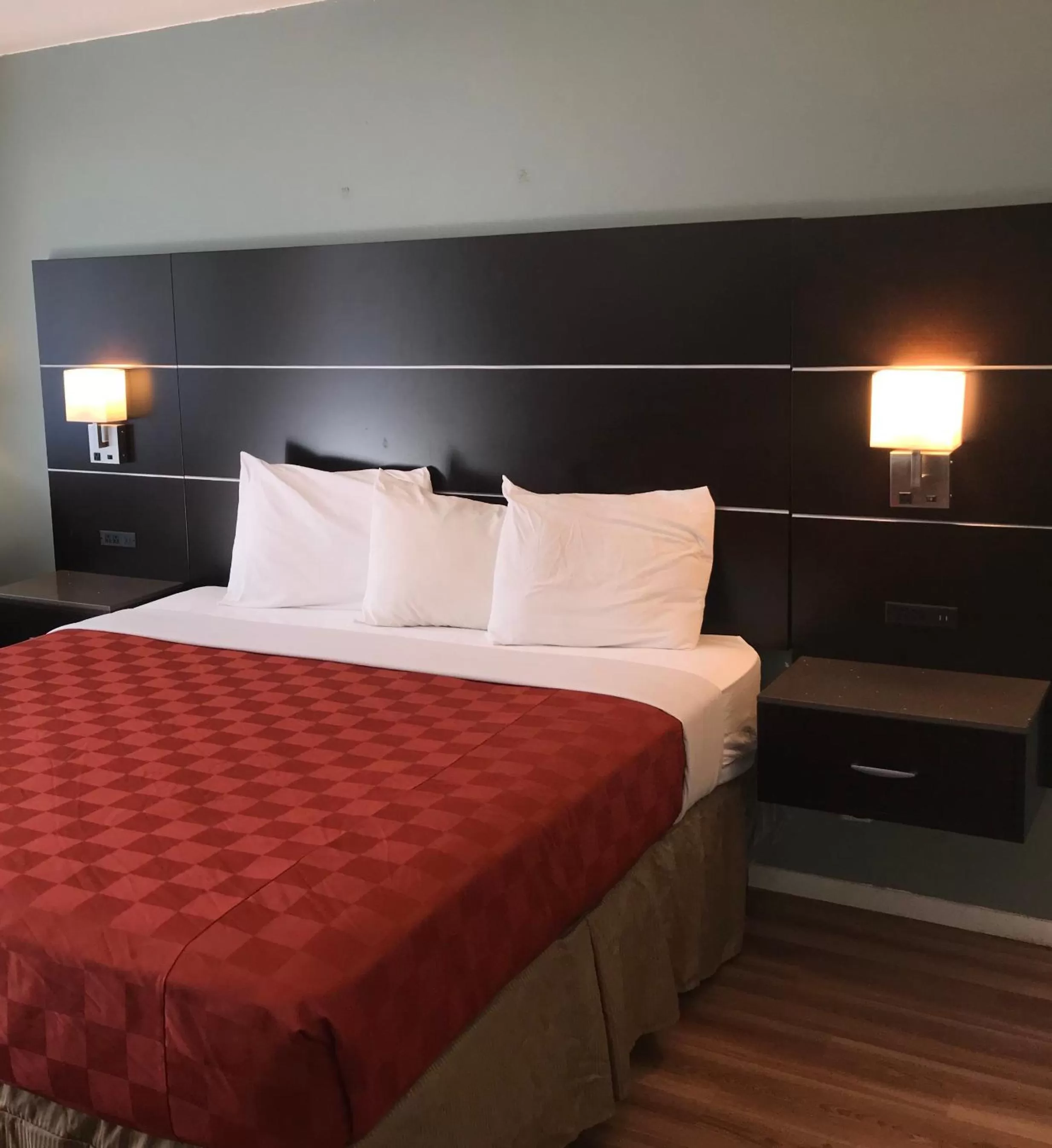 Bed in Olive Tree Inn & Suites