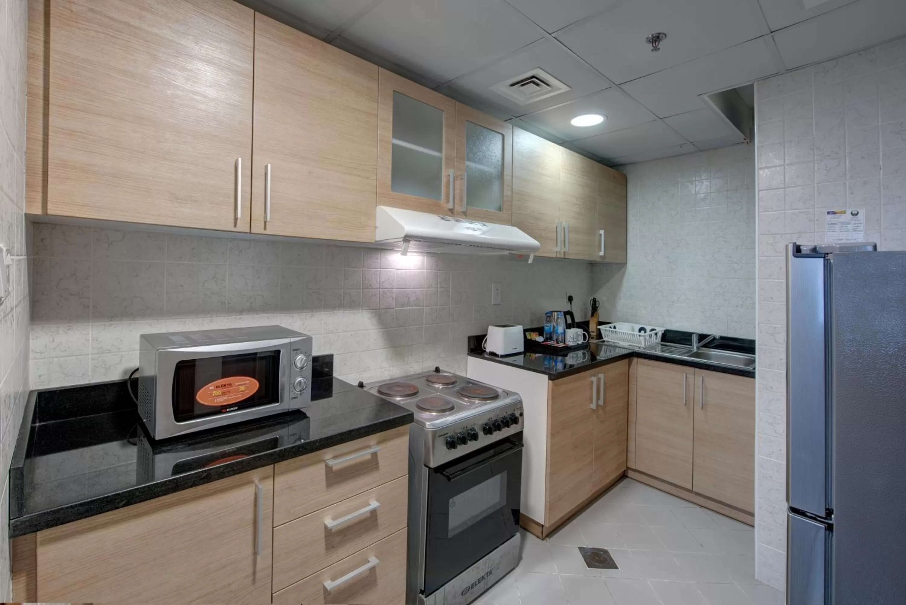 Kitchen or kitchenette in City Stay Beach Hotel Apartments - Marjan Island