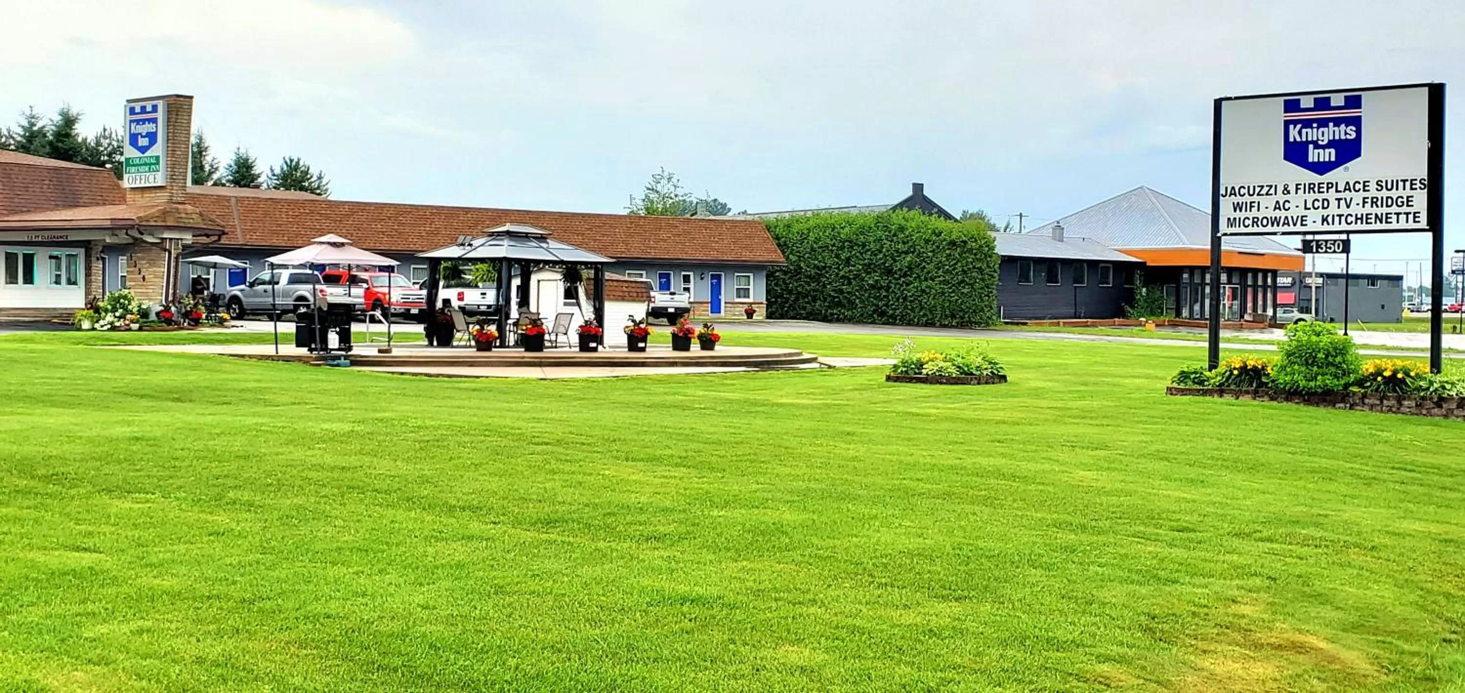 Property logo or sign in Knights Inn Colonial Fireside Inn