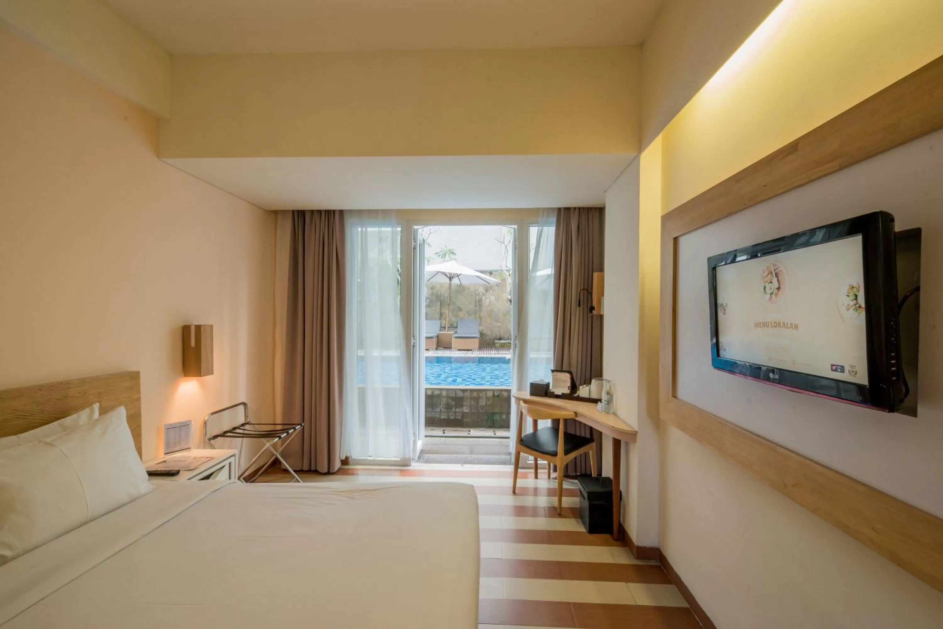 Pool view, Bed in The ONE Legian