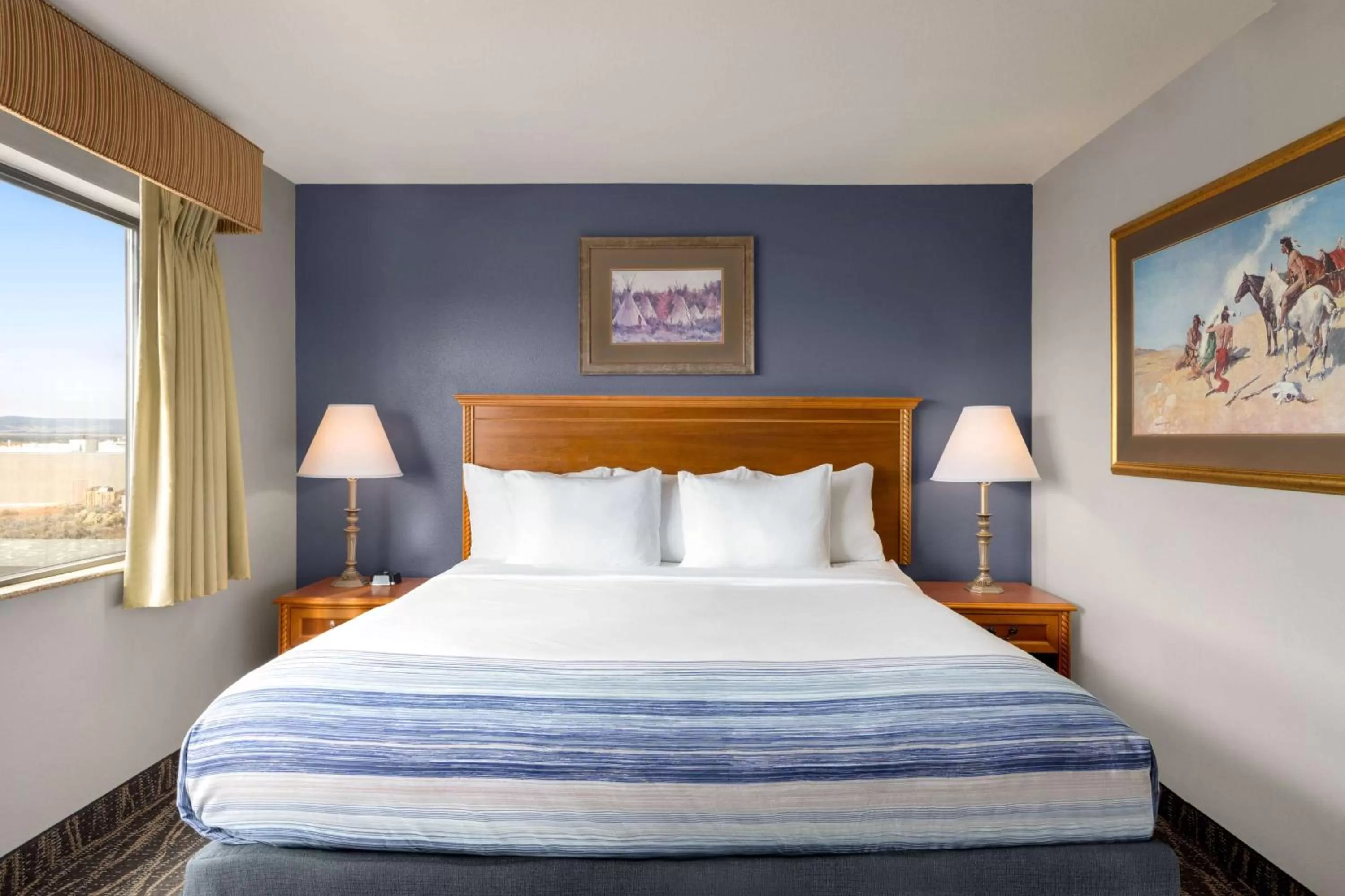 Bed in AmericInn by Wyndham Laramie Near University of Wyoming