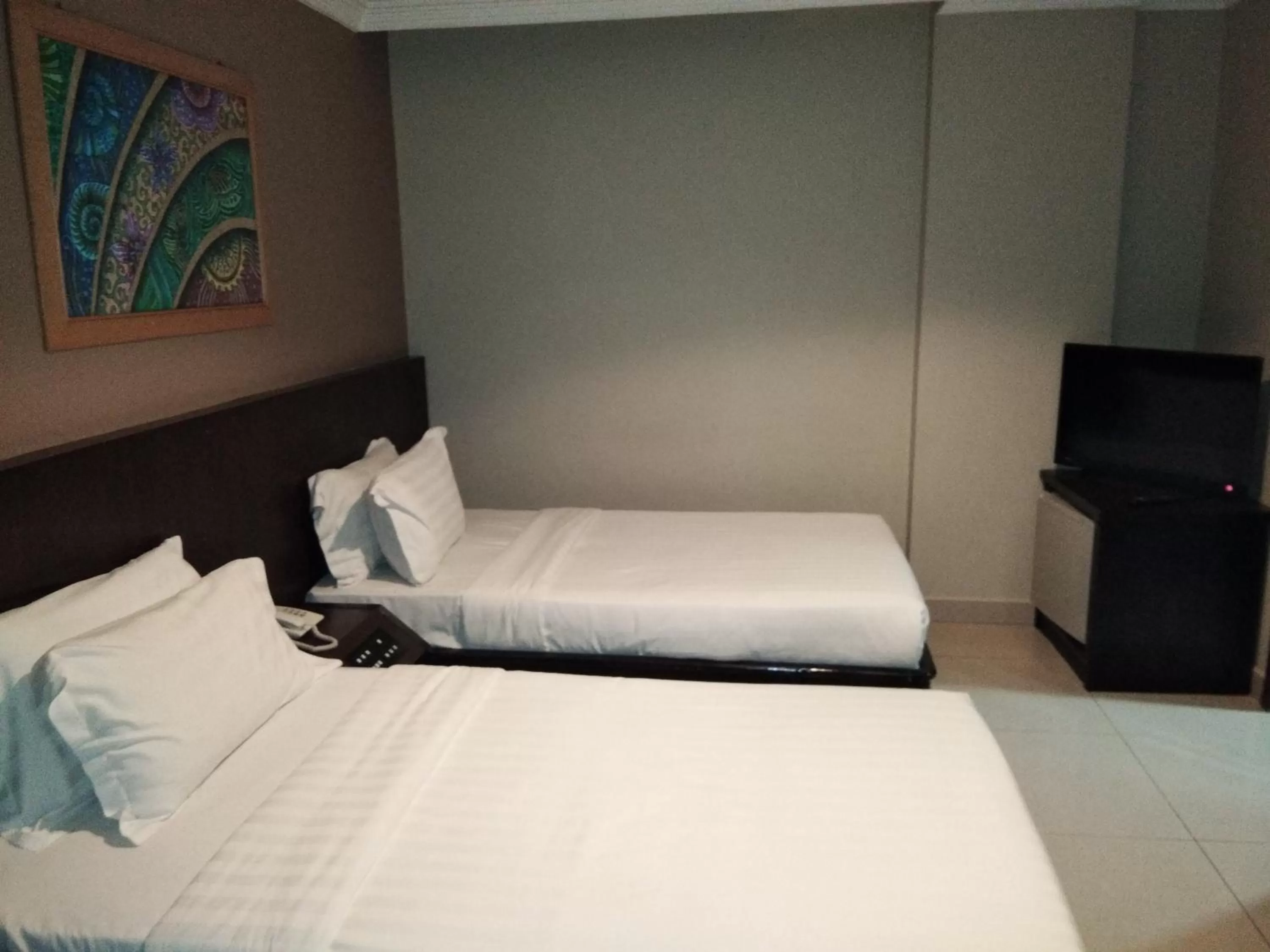 Bed in Kinabalu Daya Hotel