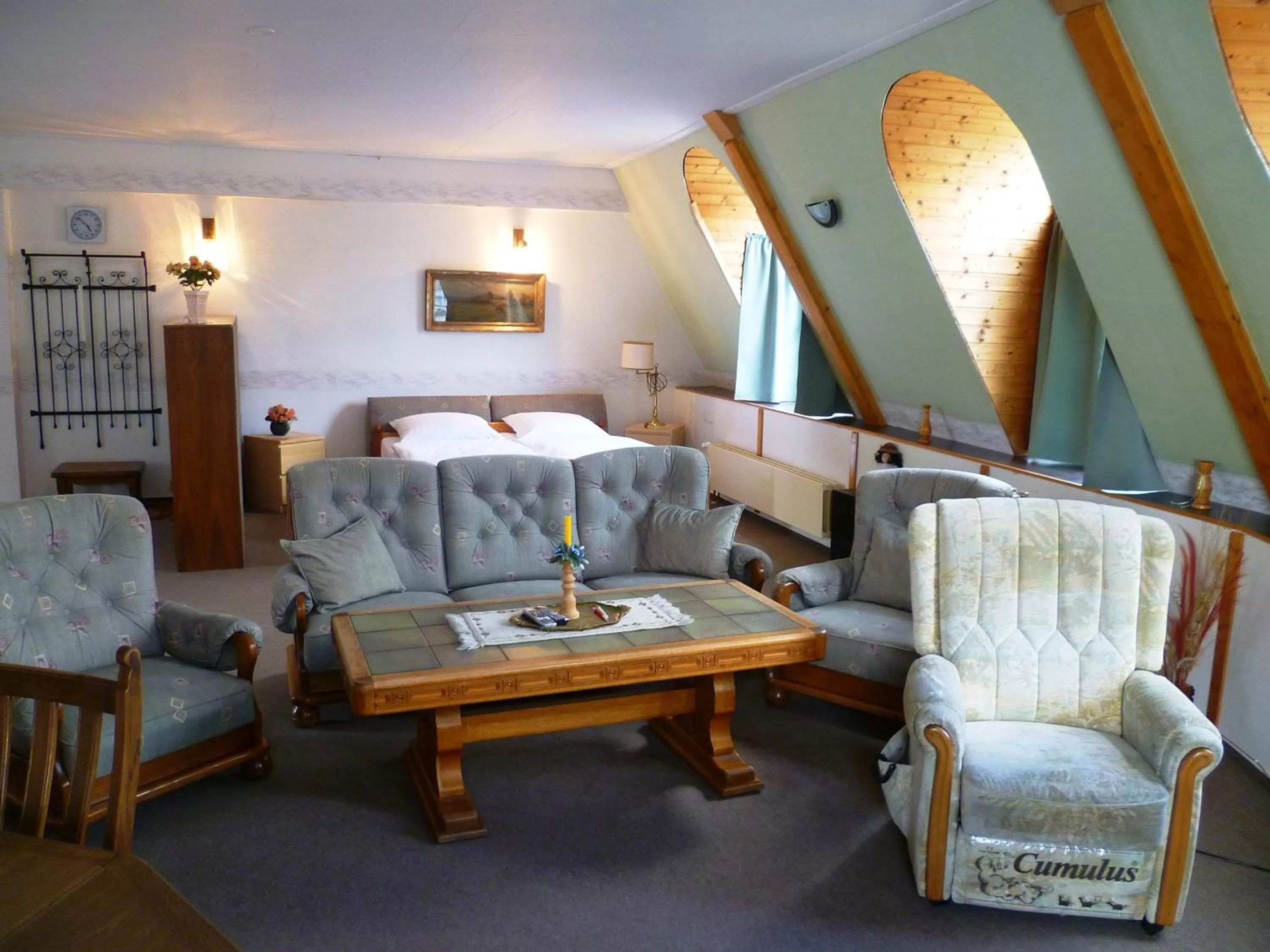 Living room, Bed in Hotel Koruna