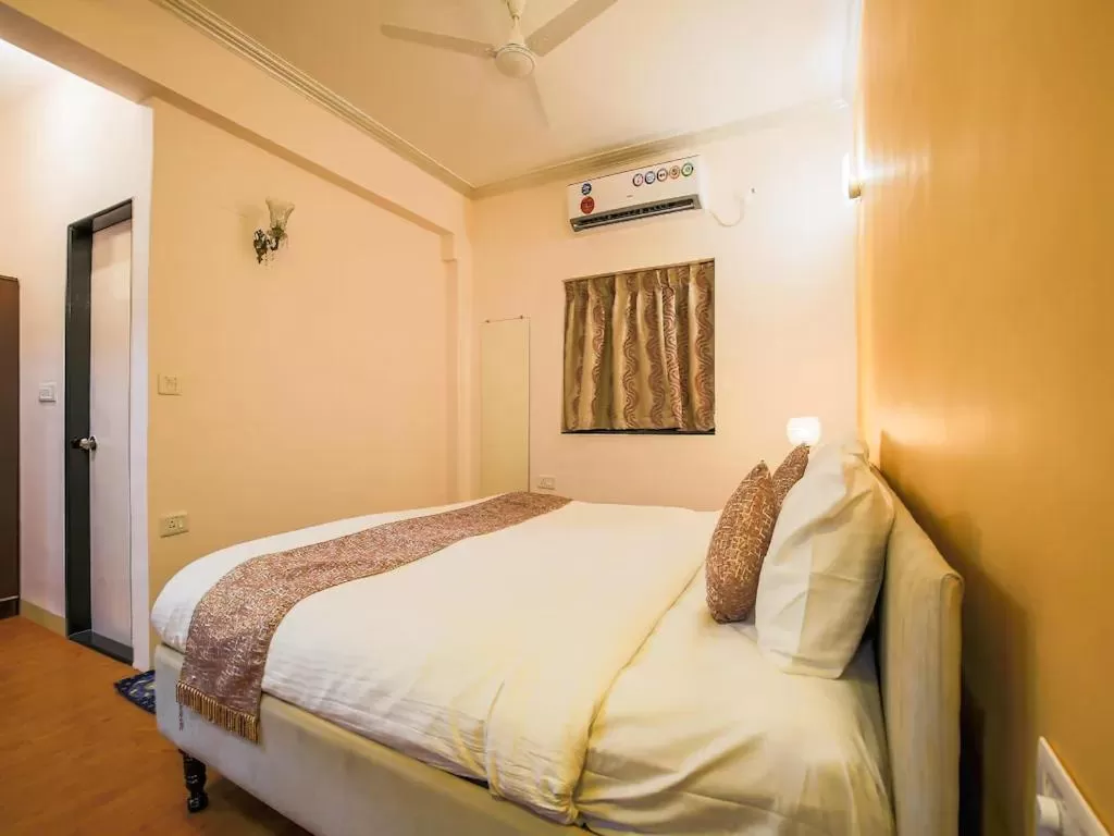 Bed in The Center Court Resort & Spa