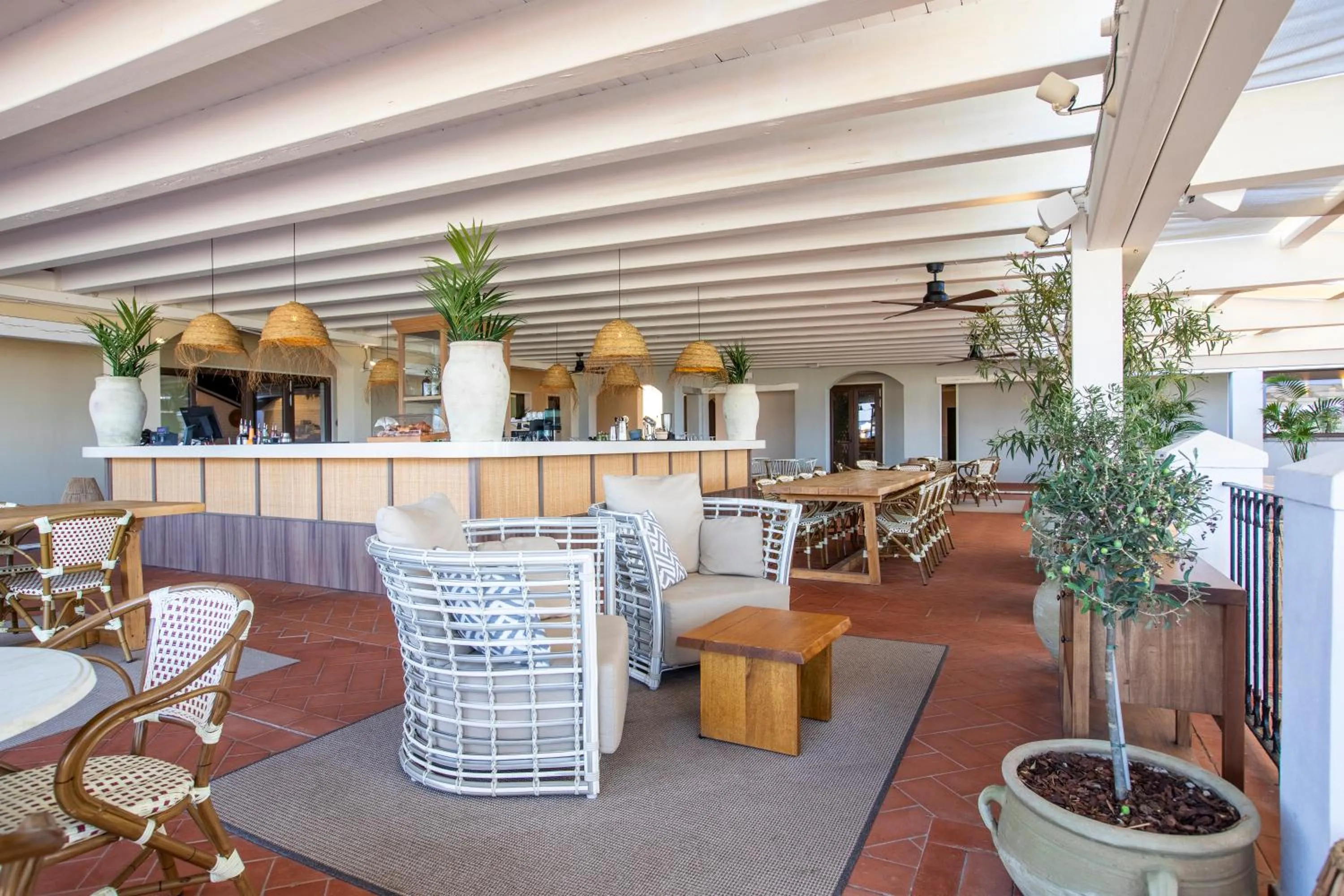 Lounge or bar in Mangia's Santa Teresa Sardinia, Curio Collection by Hilton