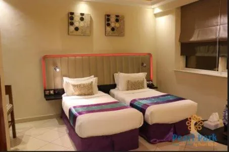 Bed in Pearl Executive Hotel Apartments
