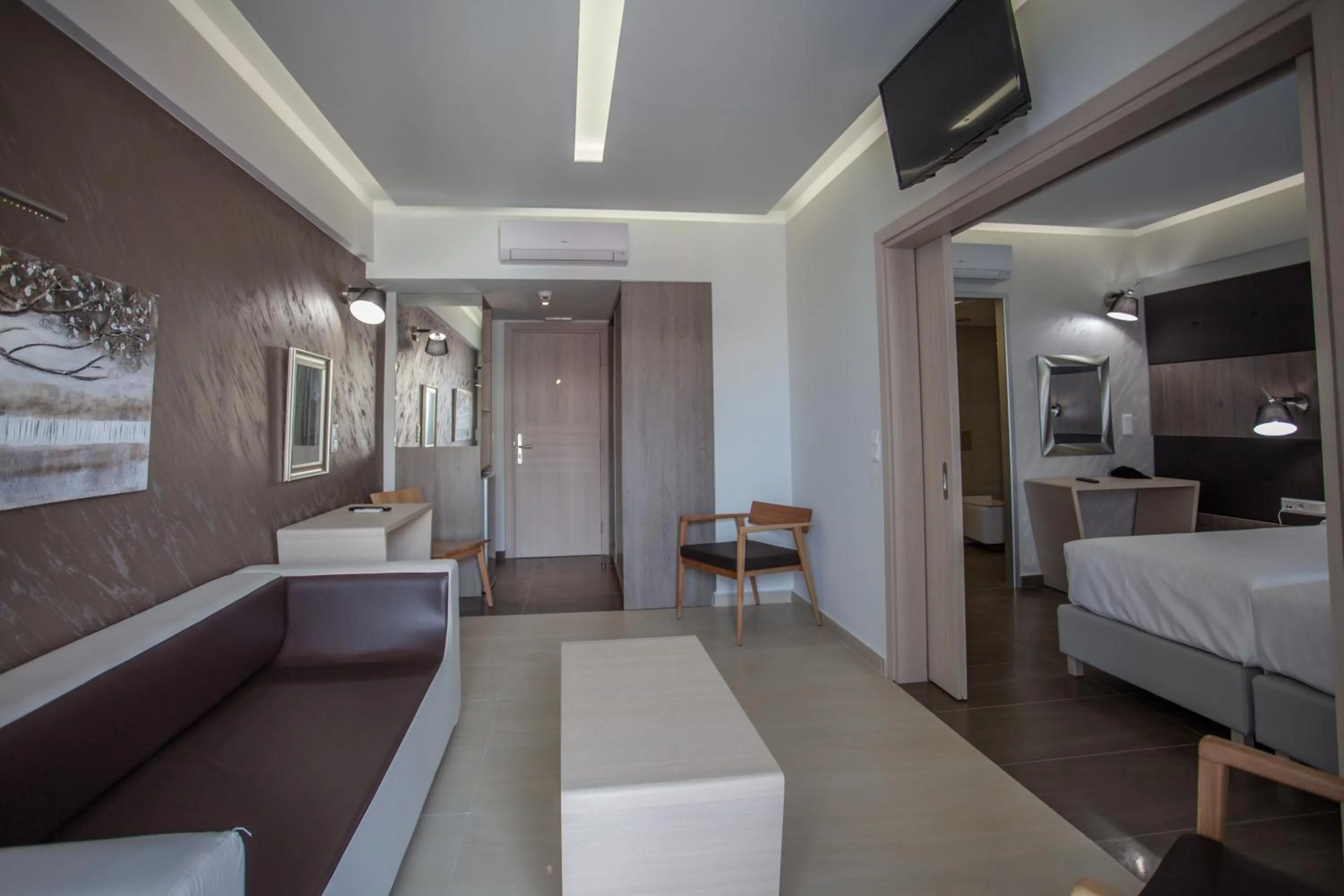 Living room, Bed in Melrose Rethymno by Mage Hotels