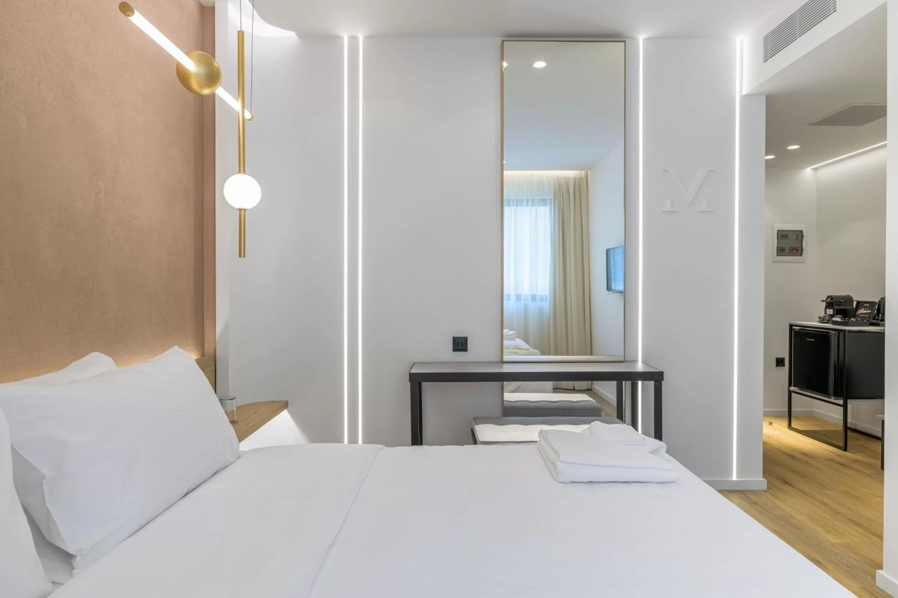 Bed in Acropolis Magenta Luxury Suites