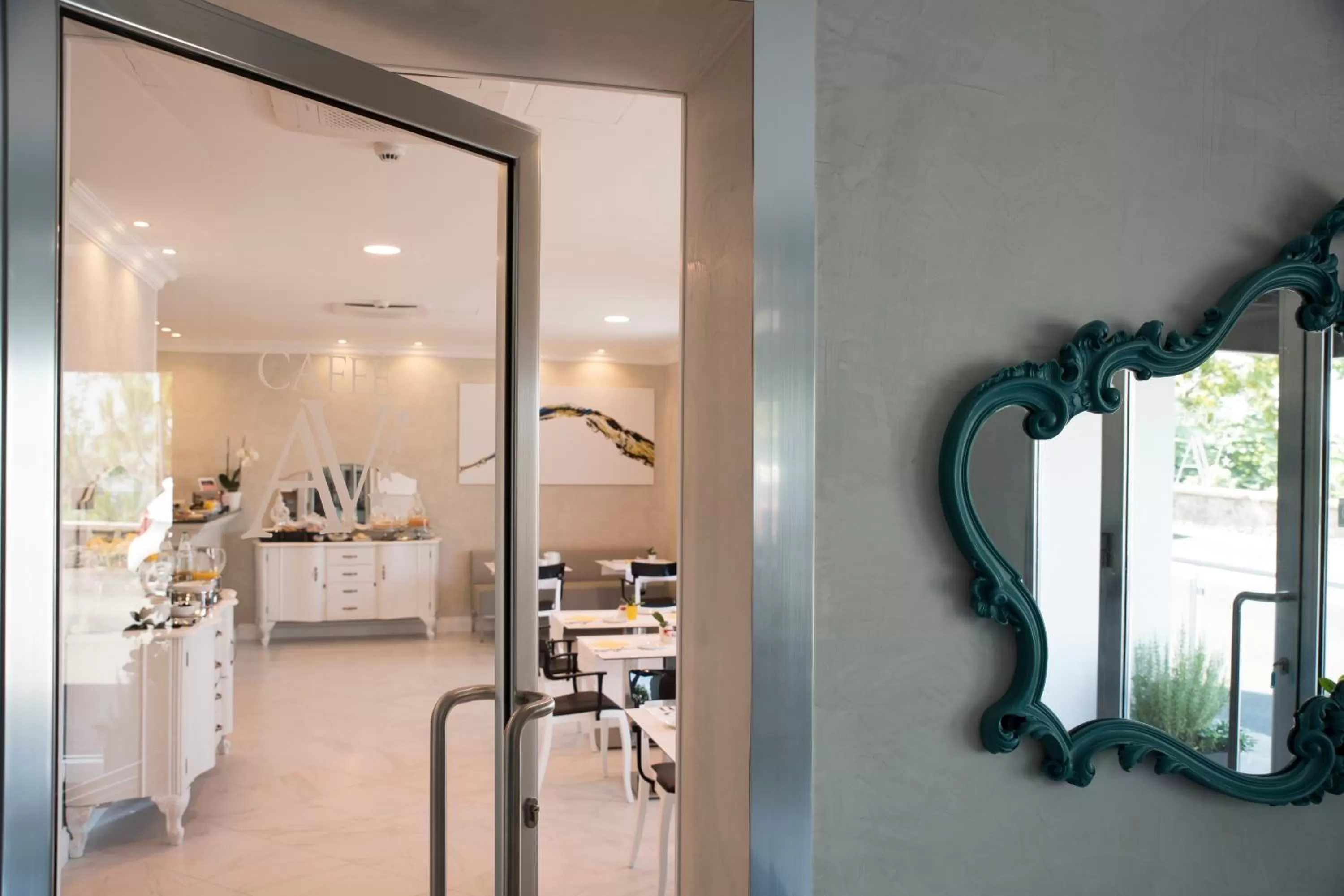 Communal lounge/ TV room in Altavilla Boutique Hotel