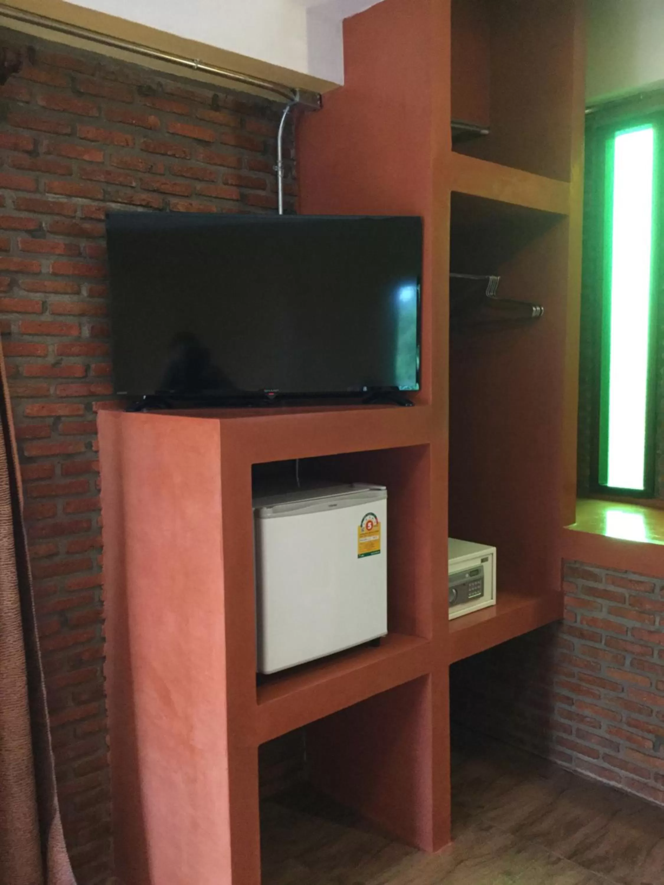 TV and multimedia in Pongphen Guesthouse - SHA Plus Certified