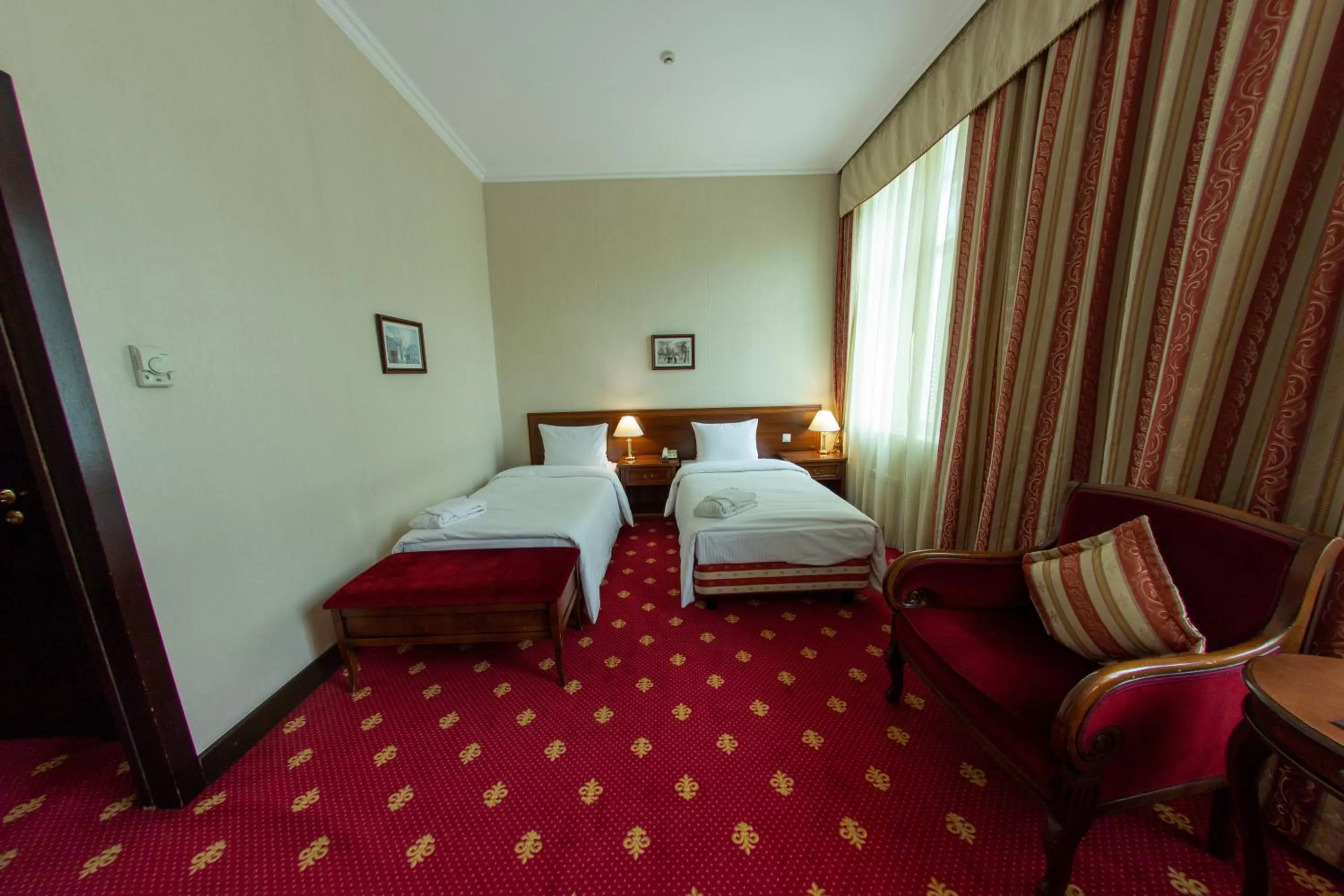 Bed in Grand Tien Shan Hotel