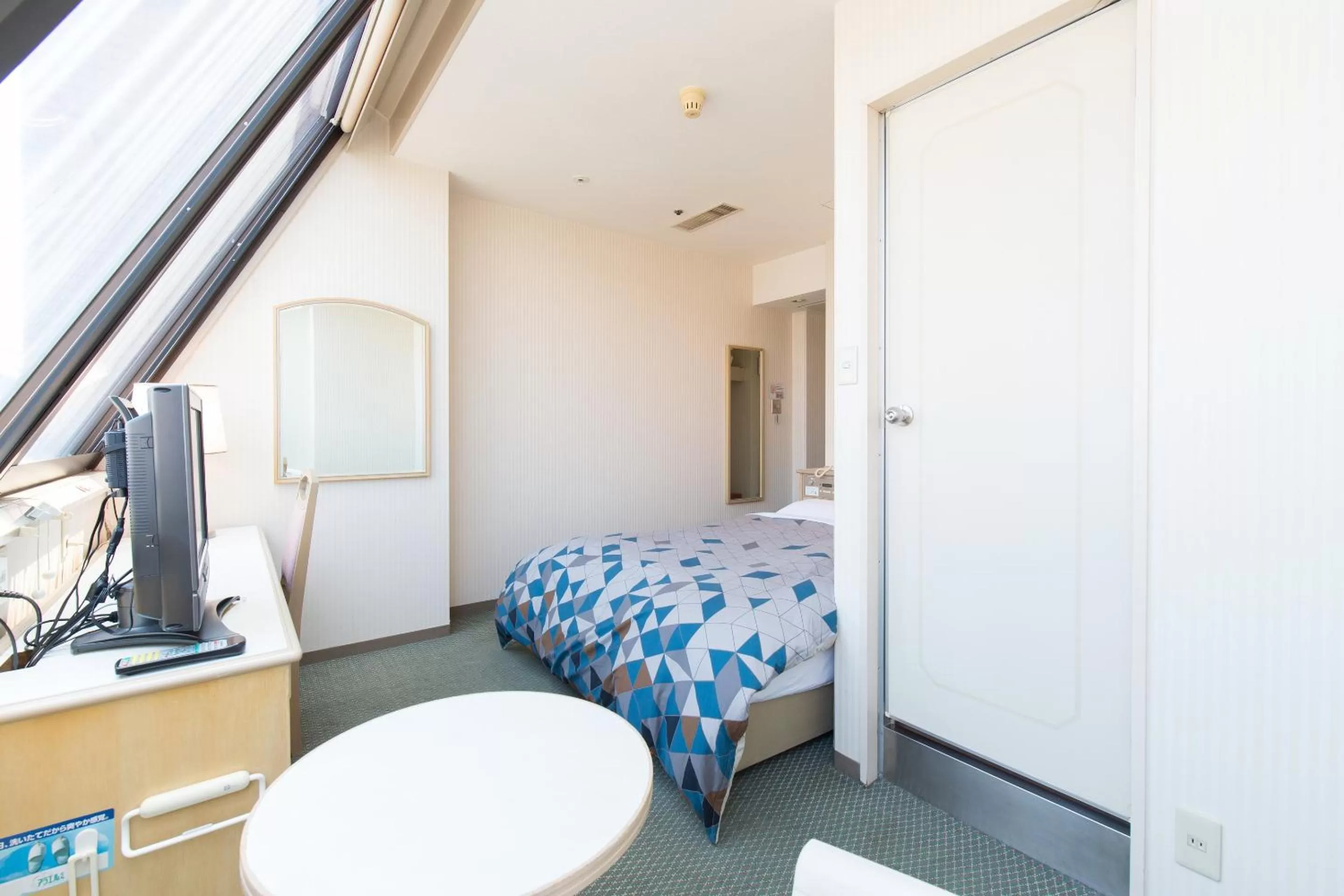 Photo of the whole room, Bed in Tabist Hotel Tetora Kitakyushu