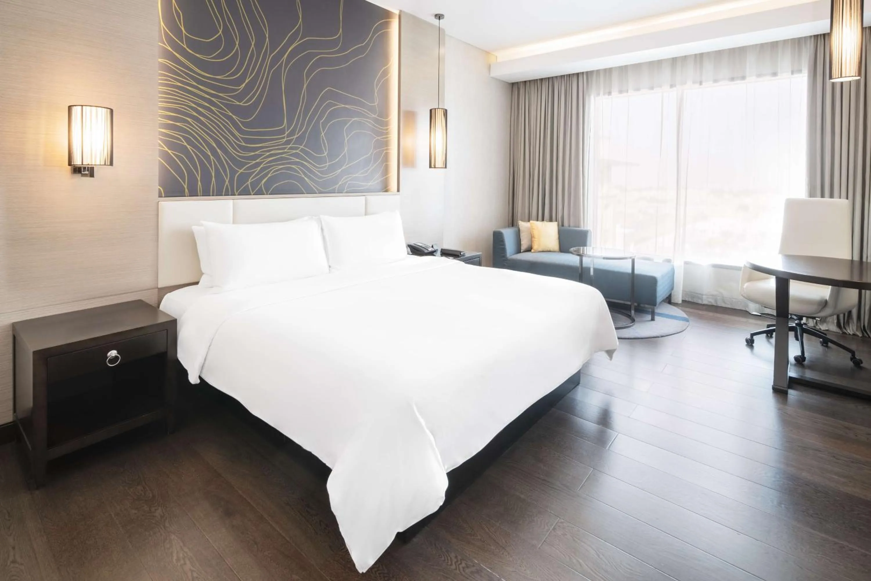 Photo of the whole room, Bed in Radisson Collection Muscat, Hormuz Grand