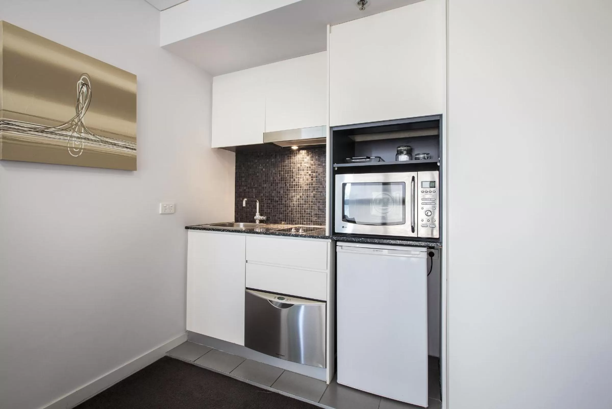 Kitchen or kitchenette in Evolution Apartments