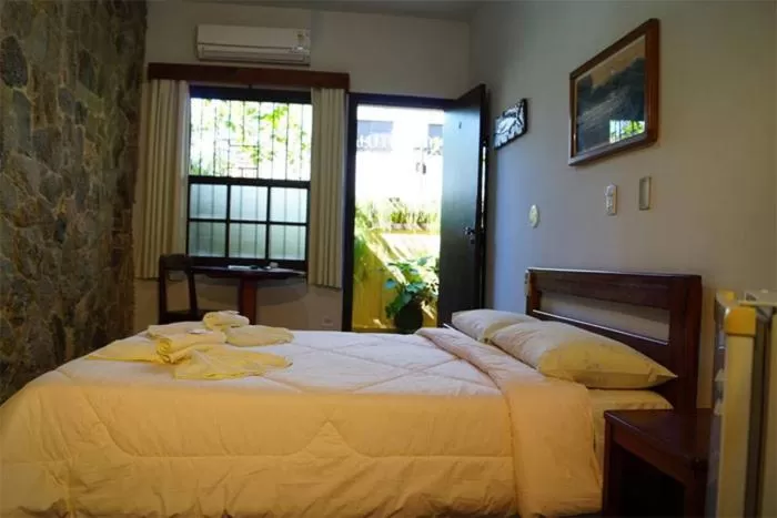 Bed in Pousada Manobra