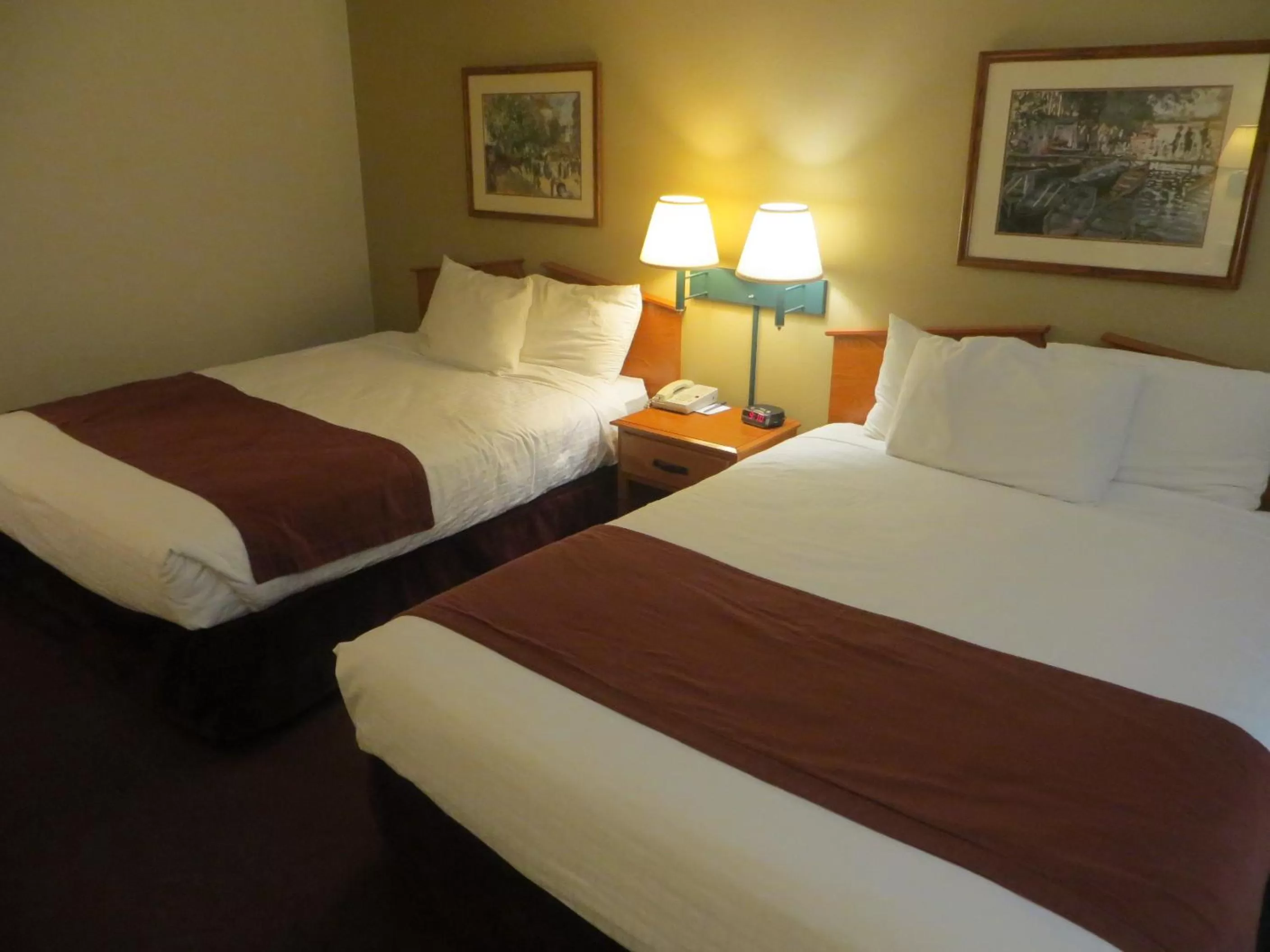 Bed in AmericInn by Wyndham Manitowoc