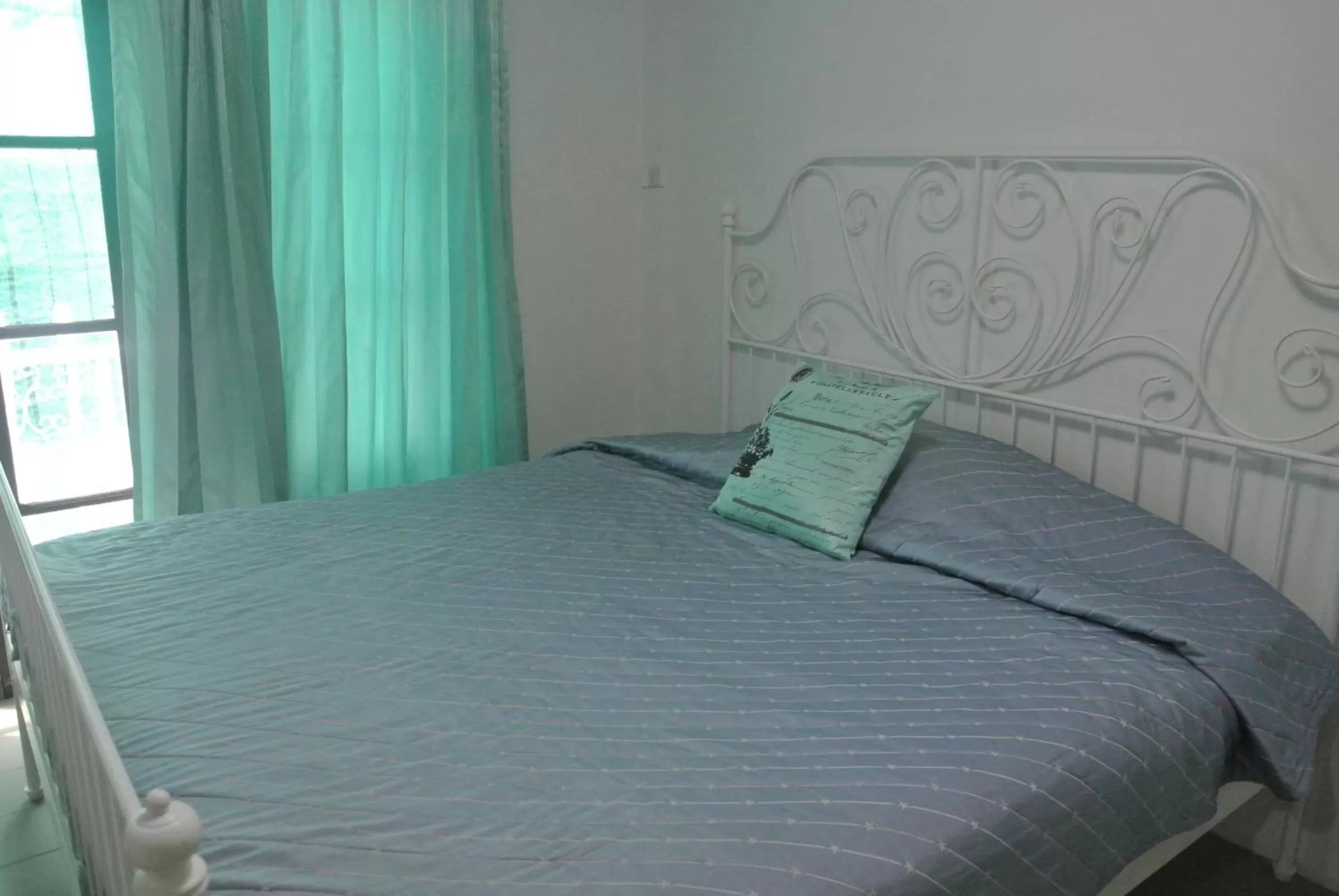 Bed in Oriental Smile Hotel