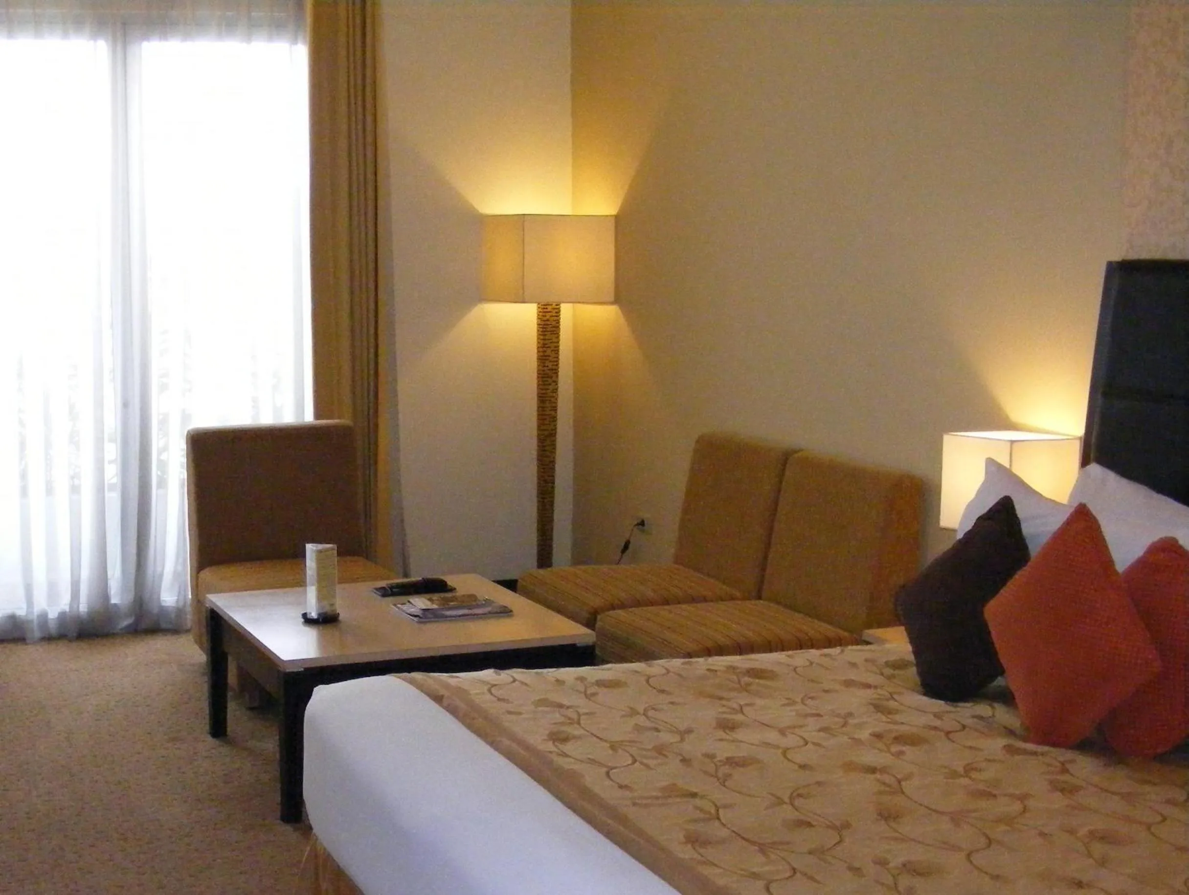 Seating area, Bed in Golden Flower by KAGUM Hotels
