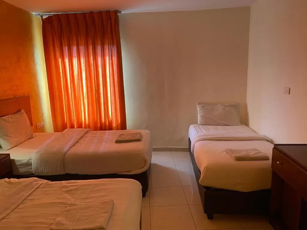 Bed in Zaina Plaza Hotel