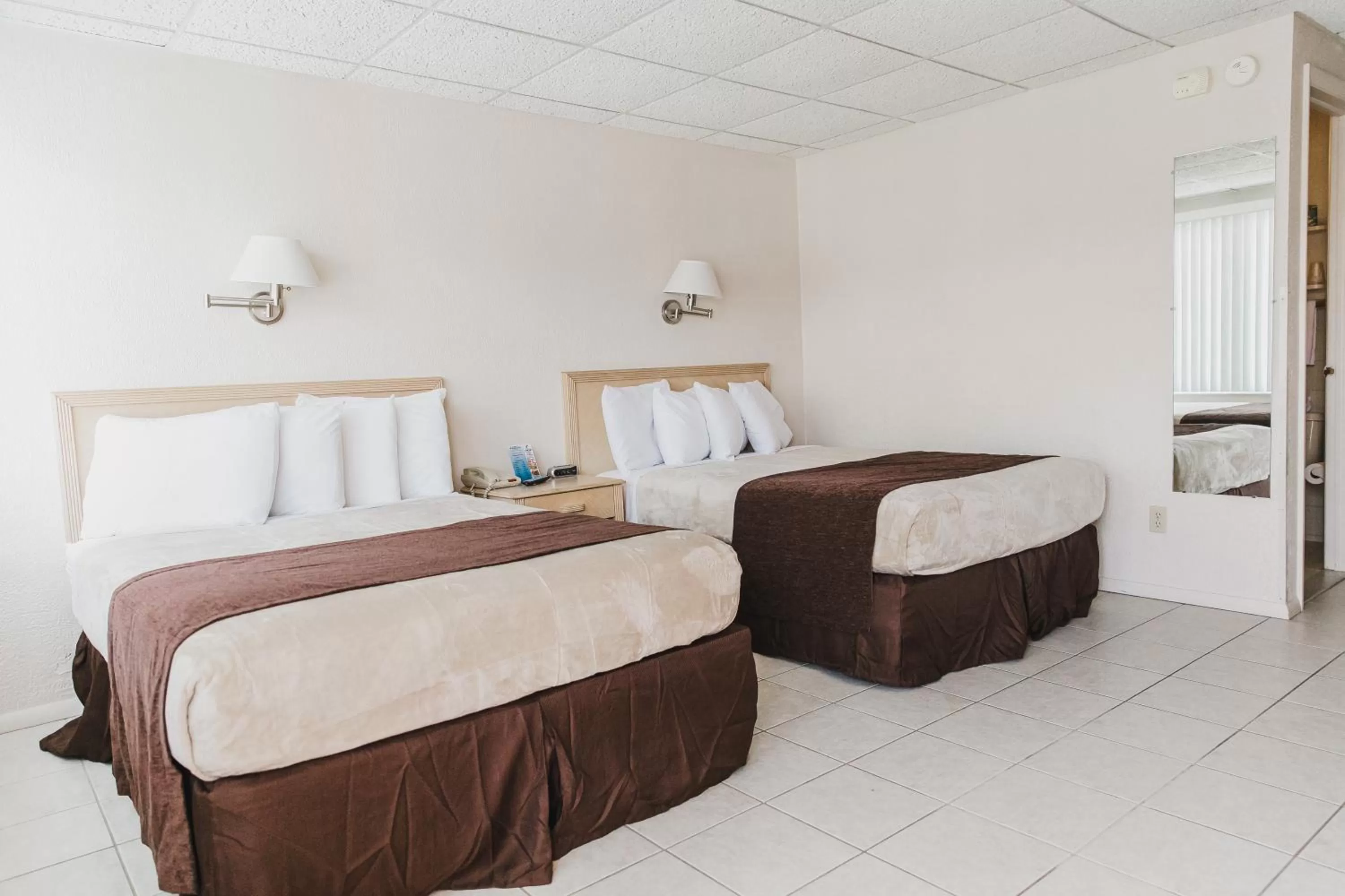 Bed in Heart of Wildwood Boardwalk Motel