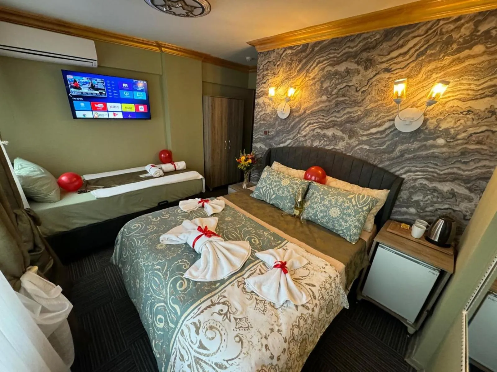 Bed in Royal Gur Hotel