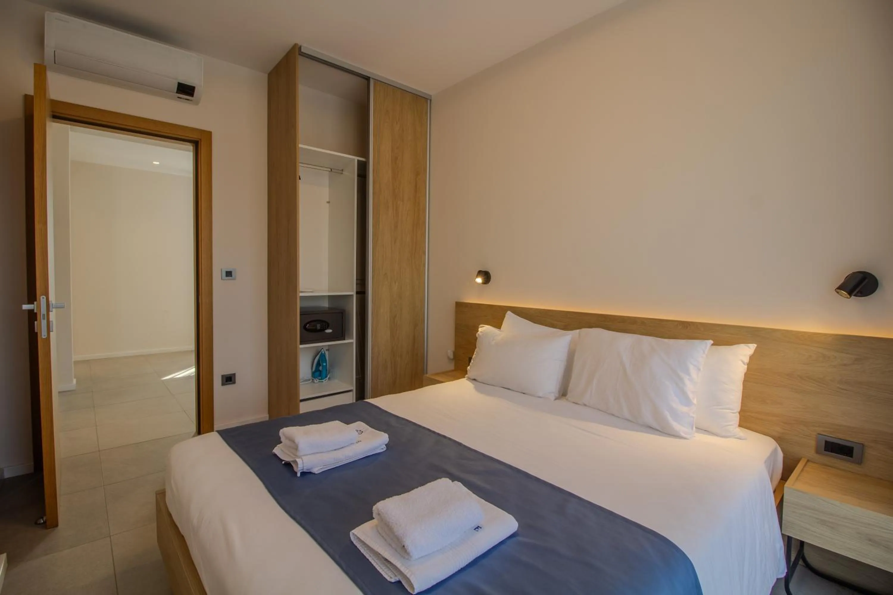 Bed in Royal Blue Resort & Residences